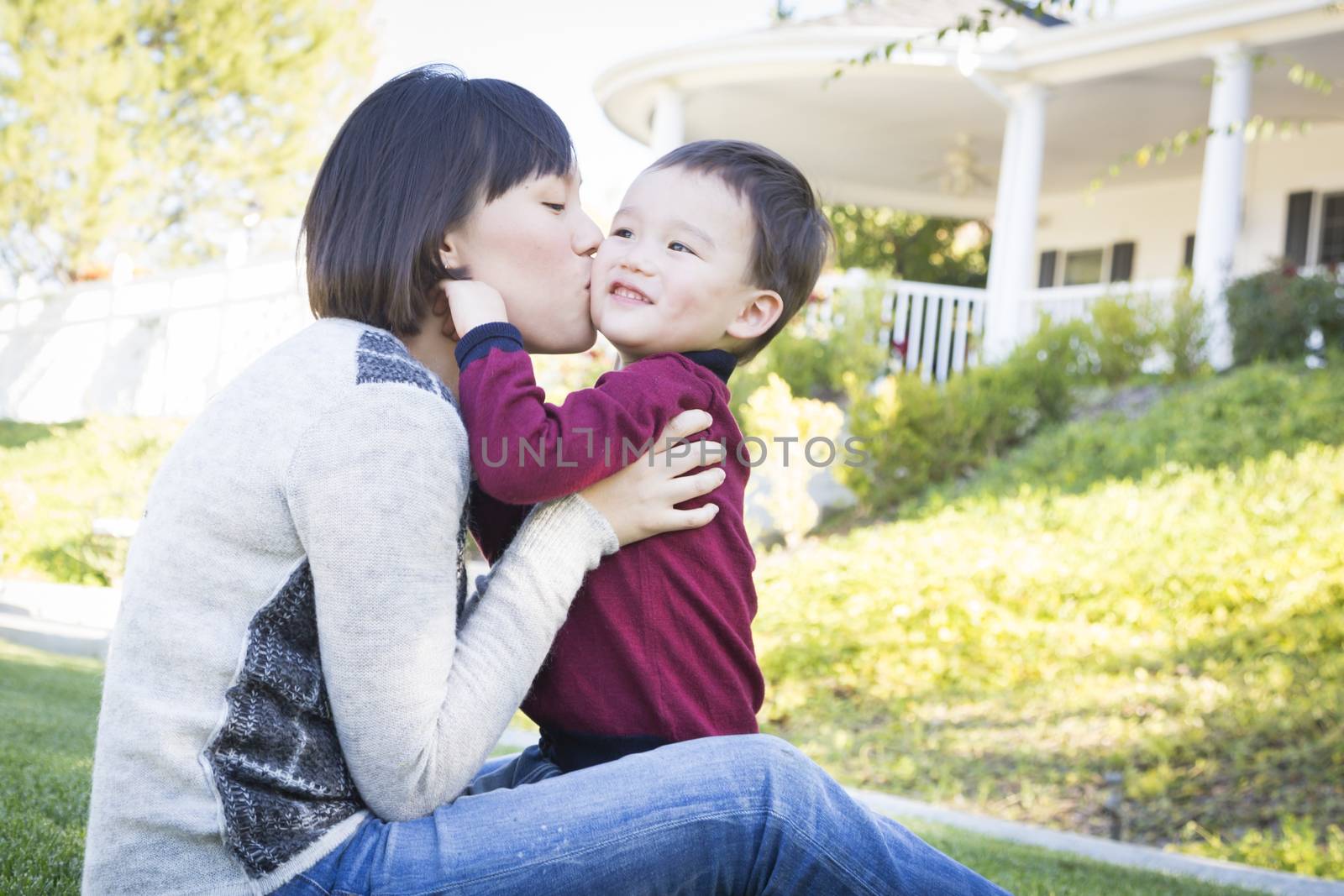 Happy Chinese Mother Having Fun with Her Mixed Race Baby Son.