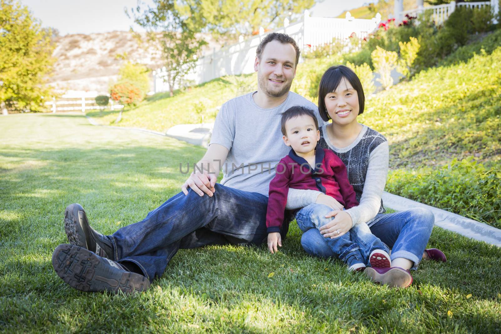 Mixed Race Family Having Fun Outside by Feverpitched