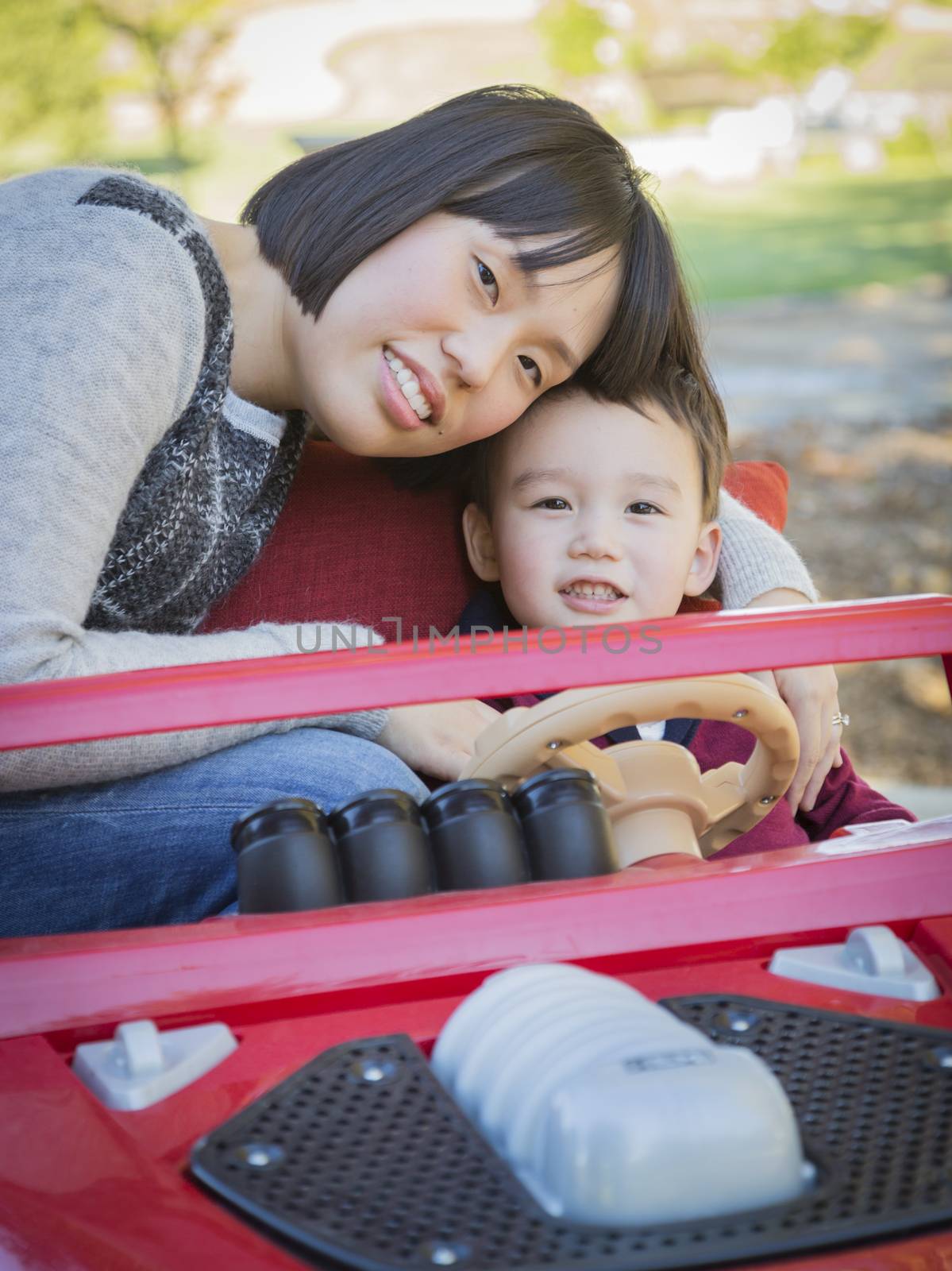 Happy Chinese Mother Having Fun with Her Mixed Race Baby Son.