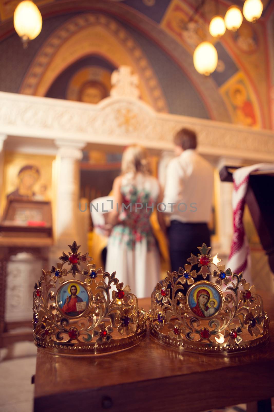 Married couple kissing in a church by sarymsakov