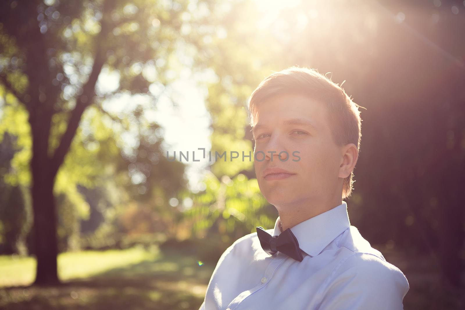 Elegant young handsome groom. The fashion portrait.