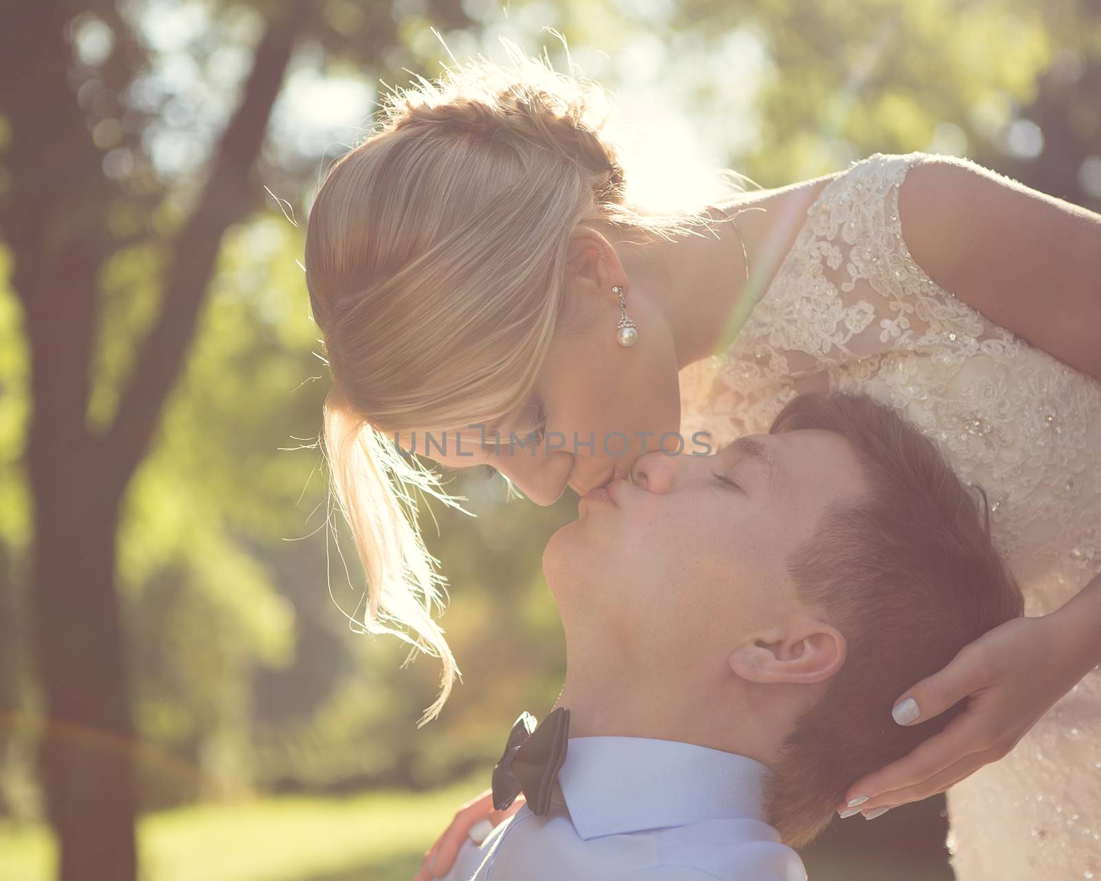 Beautiful wedding couple is enjoying wedding in the sun. 