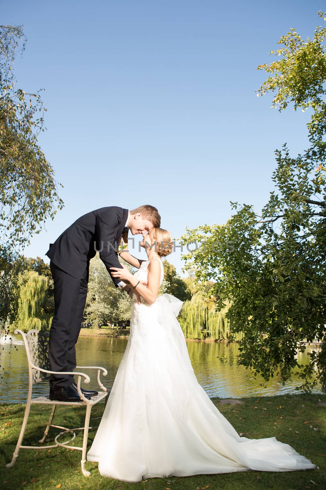 Beautiful wedding couple is enjoying wedding in the sun. 