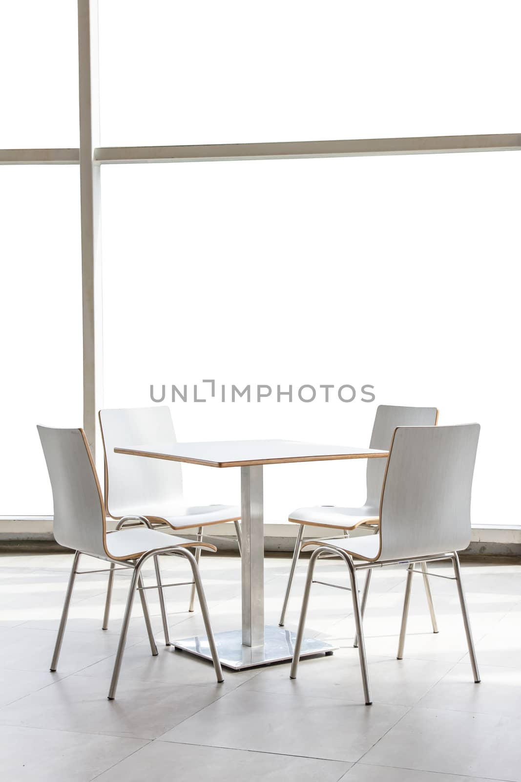 tables and chairs set on floor isolated on white background