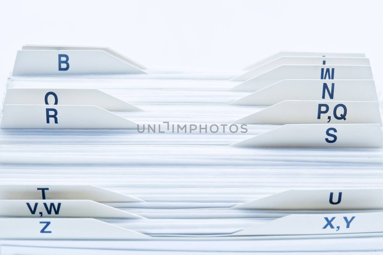 closeup of rolodex cards organized by alphabetical order