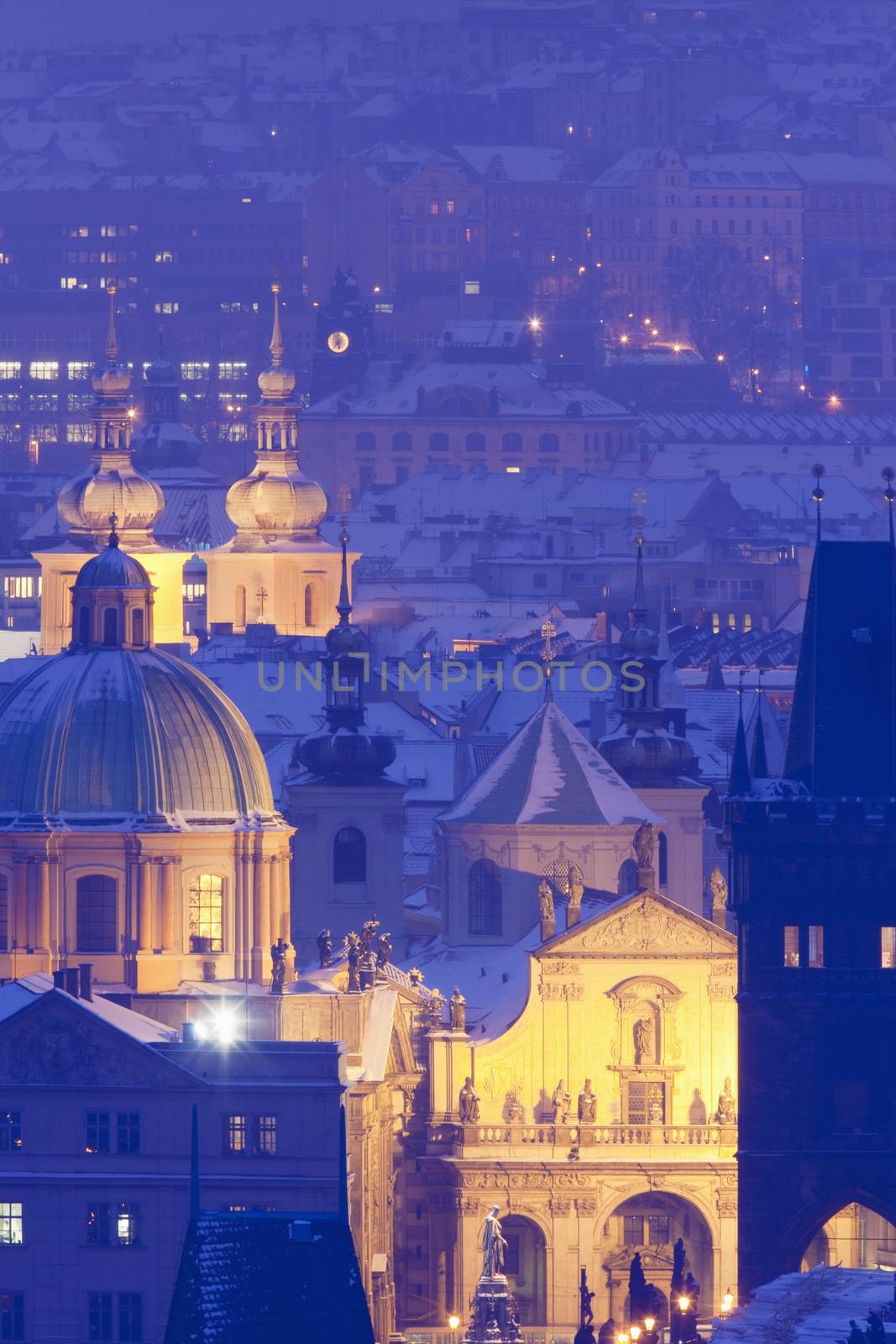 czech republic, prague - illuminated spires of the old town in winter