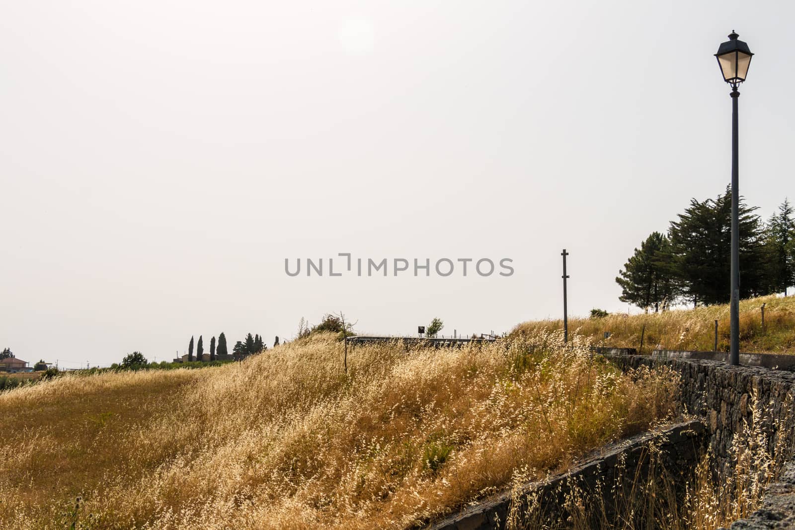 Sicilian landscape in summer with dry grass