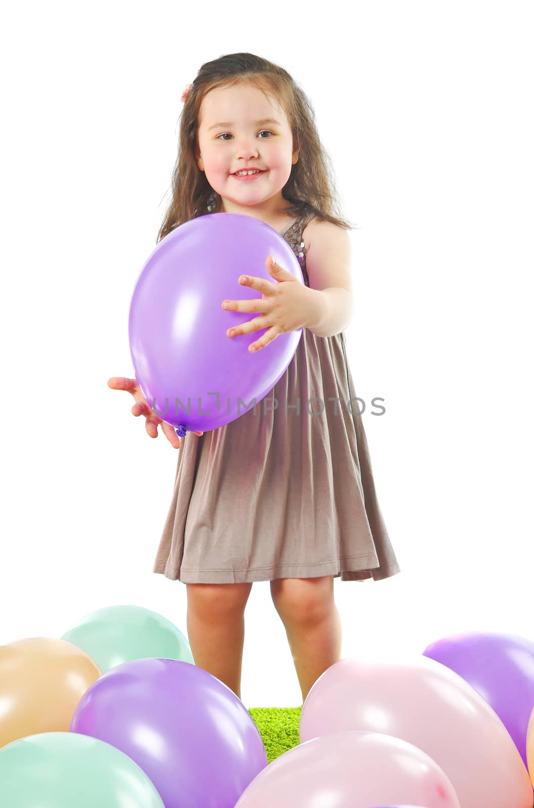 smiling little girl with balloon isolated on white