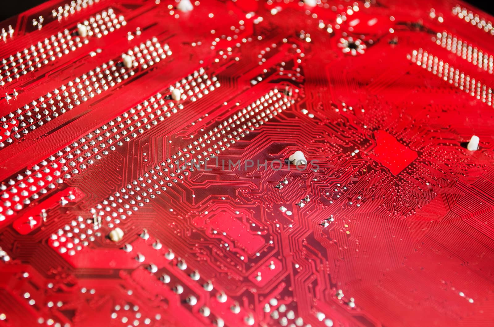 Closeup of a red printed circuit board