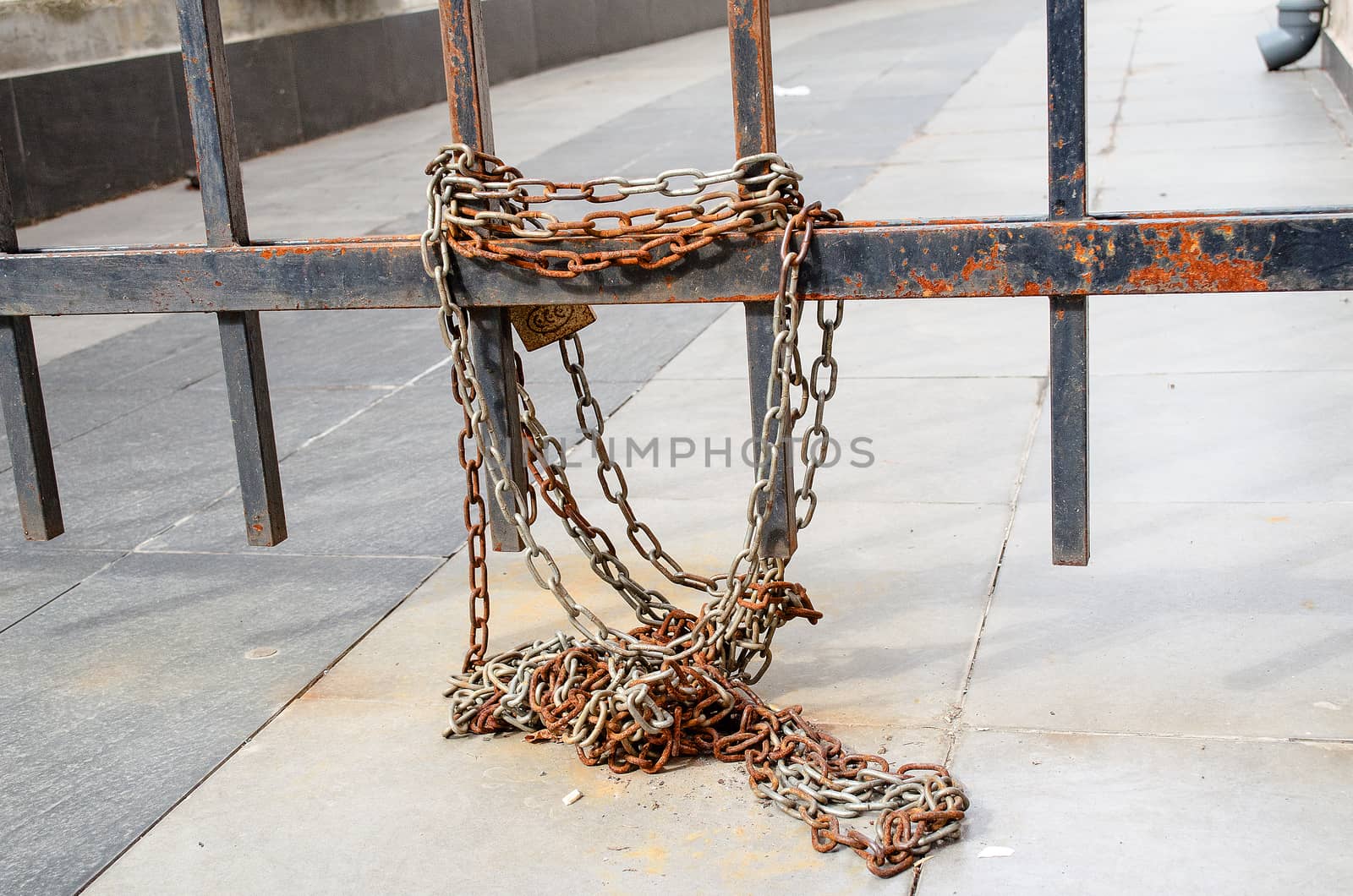 Rusty fence and chain on the bulgarian street