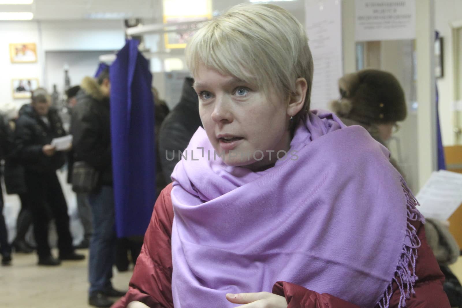 Moscow, Russia - March 4, 2012. Elections in Russia. Policies Evgeniya Chirikova communicates with observers at the polling station