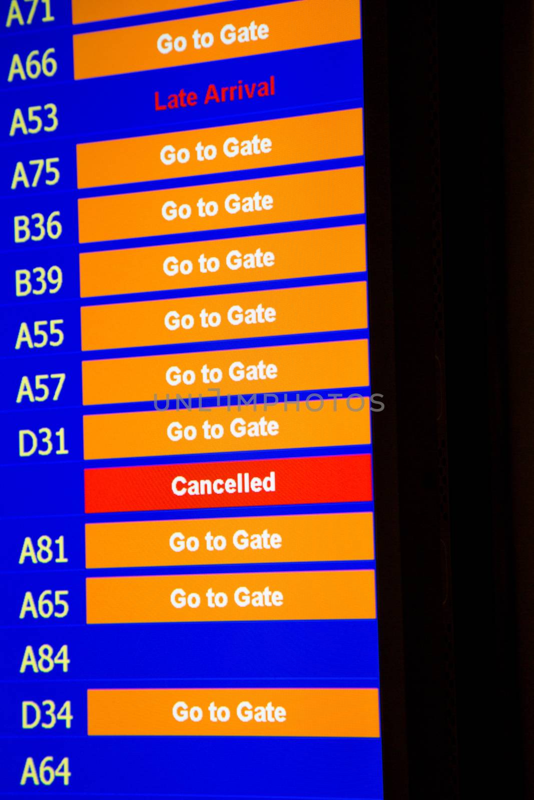 Airport departure board in terminal with flight information