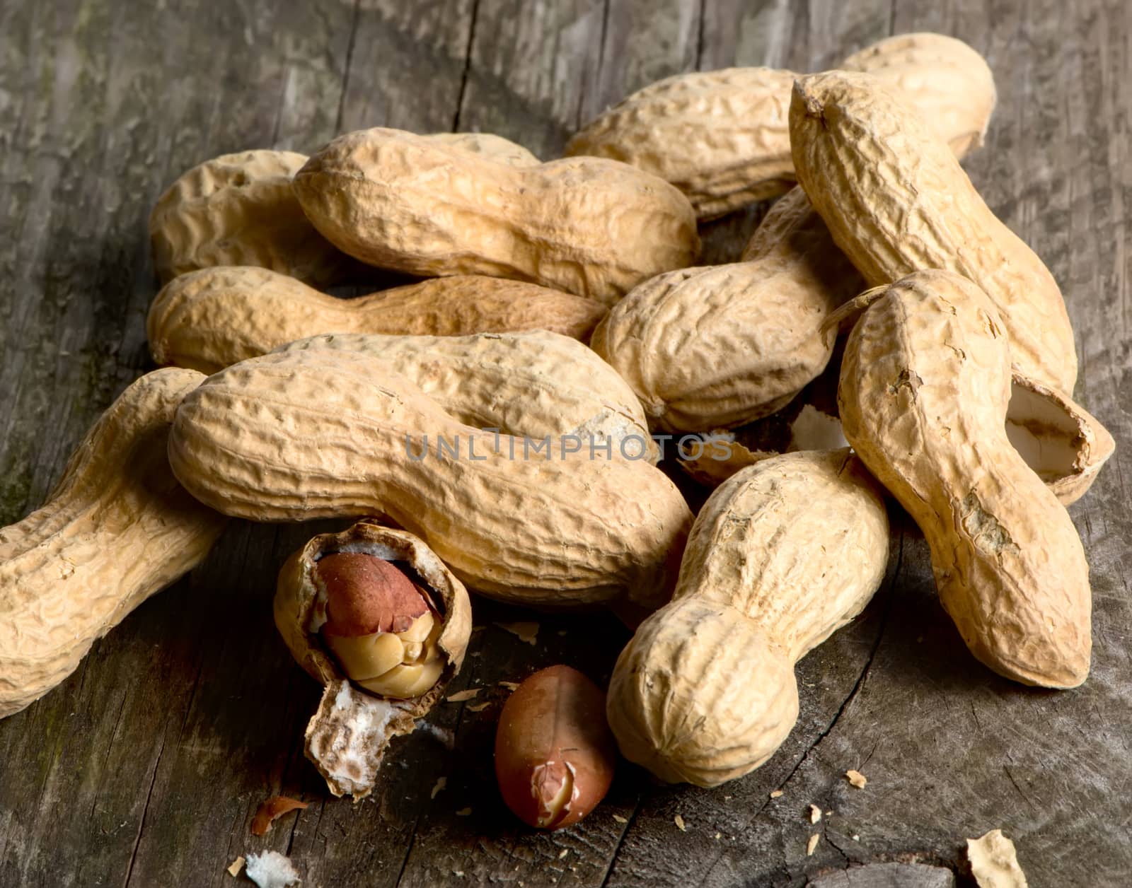 Peanuts in shell on wooden table