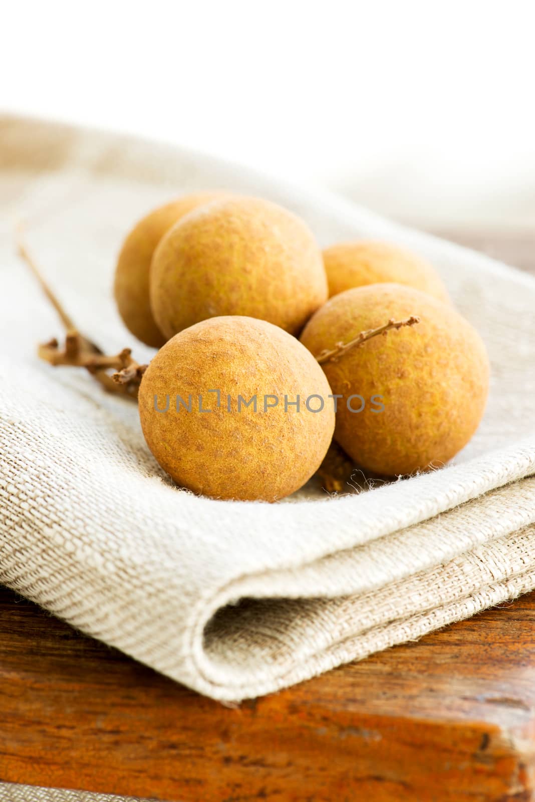 Set of litchi tropical fruits on wooden table