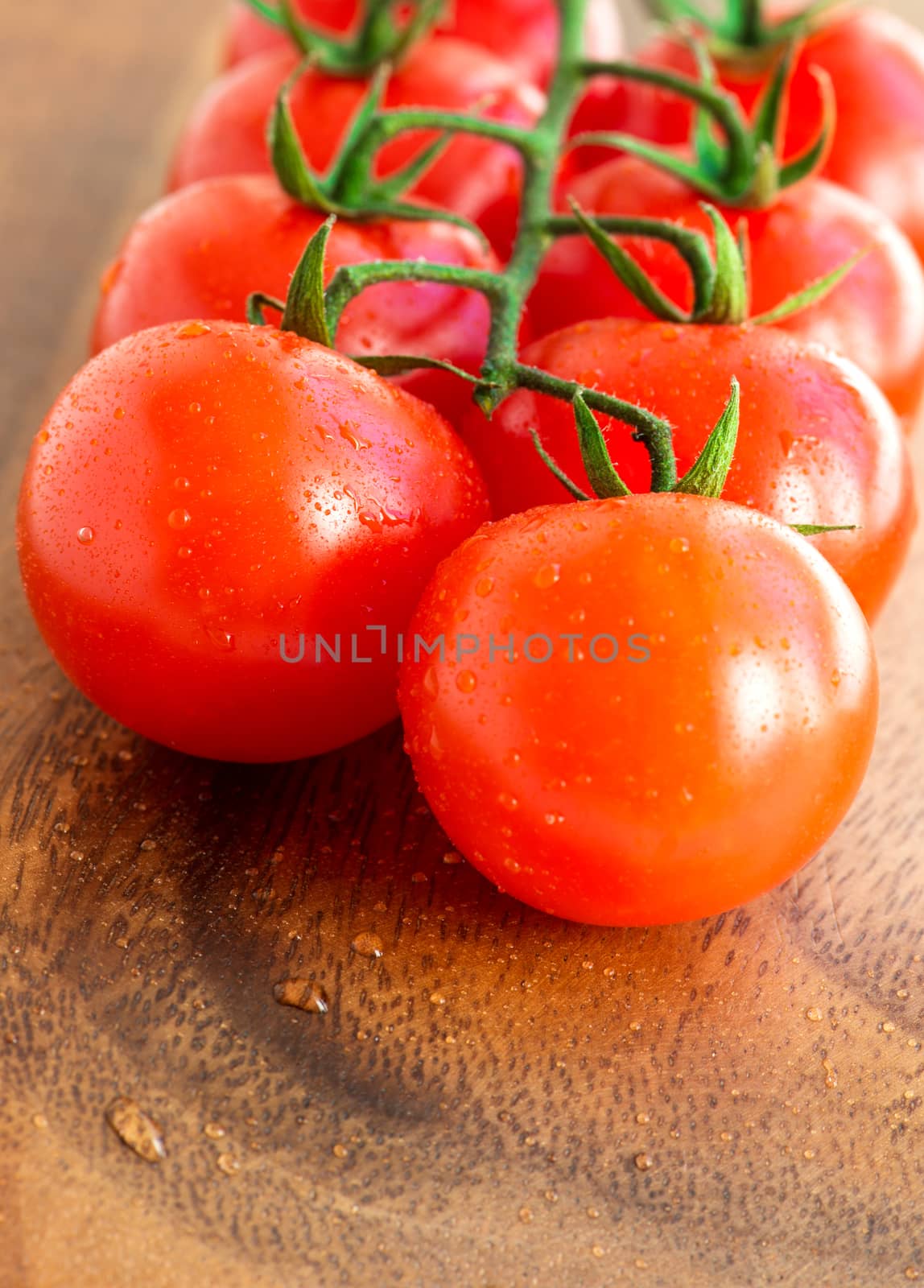 Cherry tomatoes on wooden background