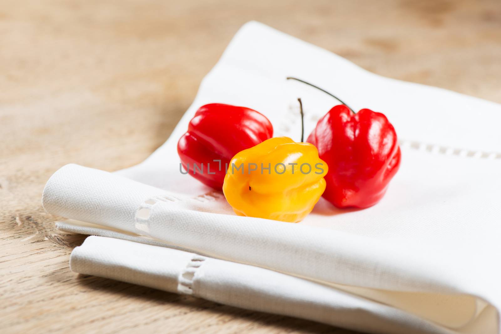 Red chili habanero peppers on napkin