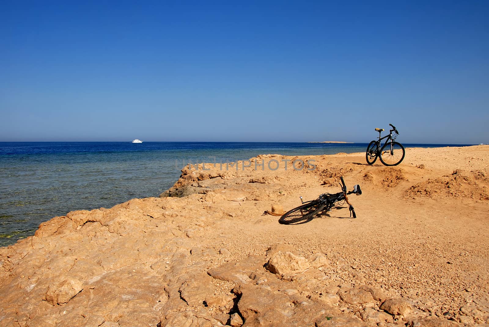 Two bicycles on the seaside by simply