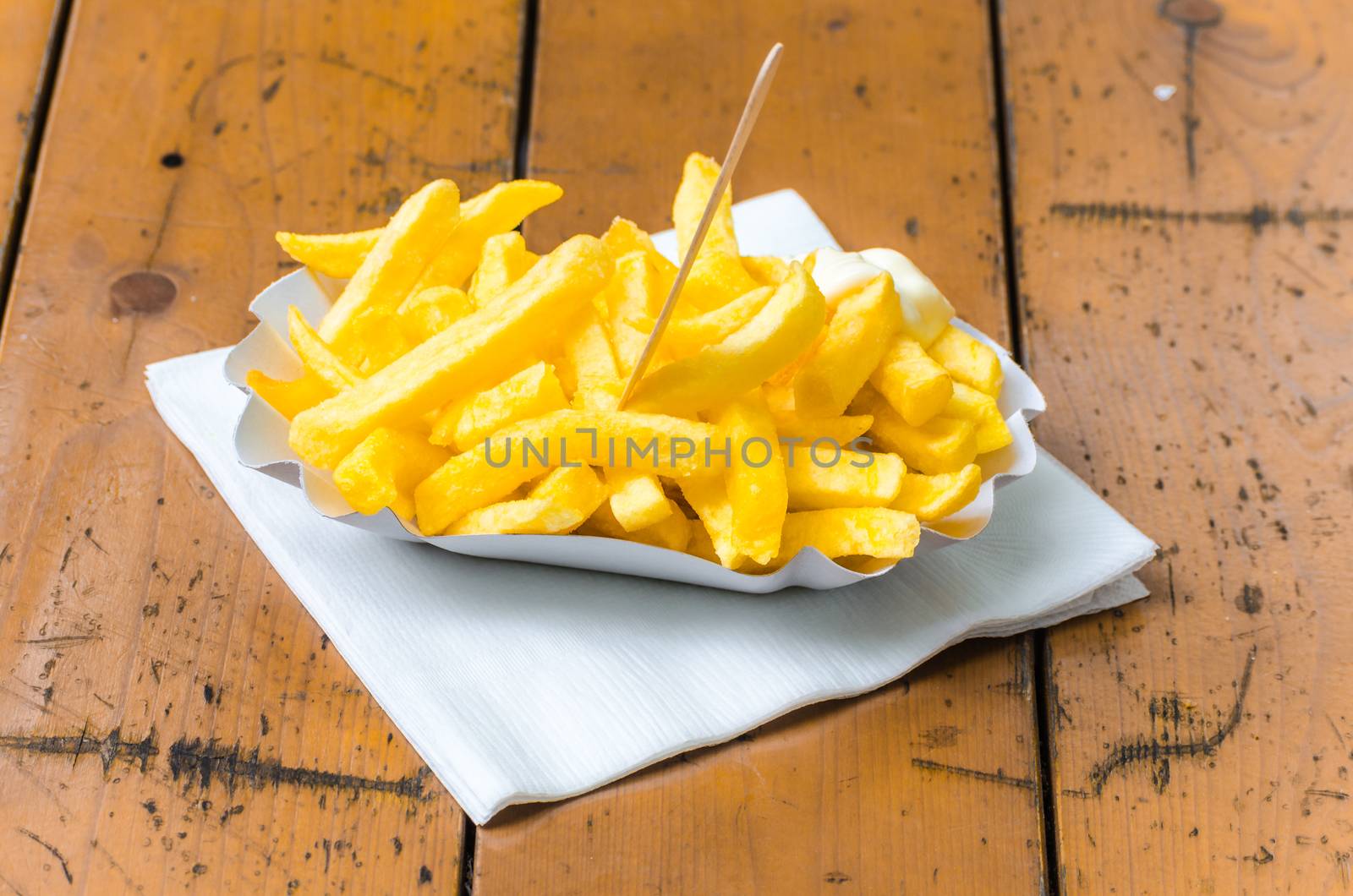 Close-up of typical fast-food meal on a wooden table.