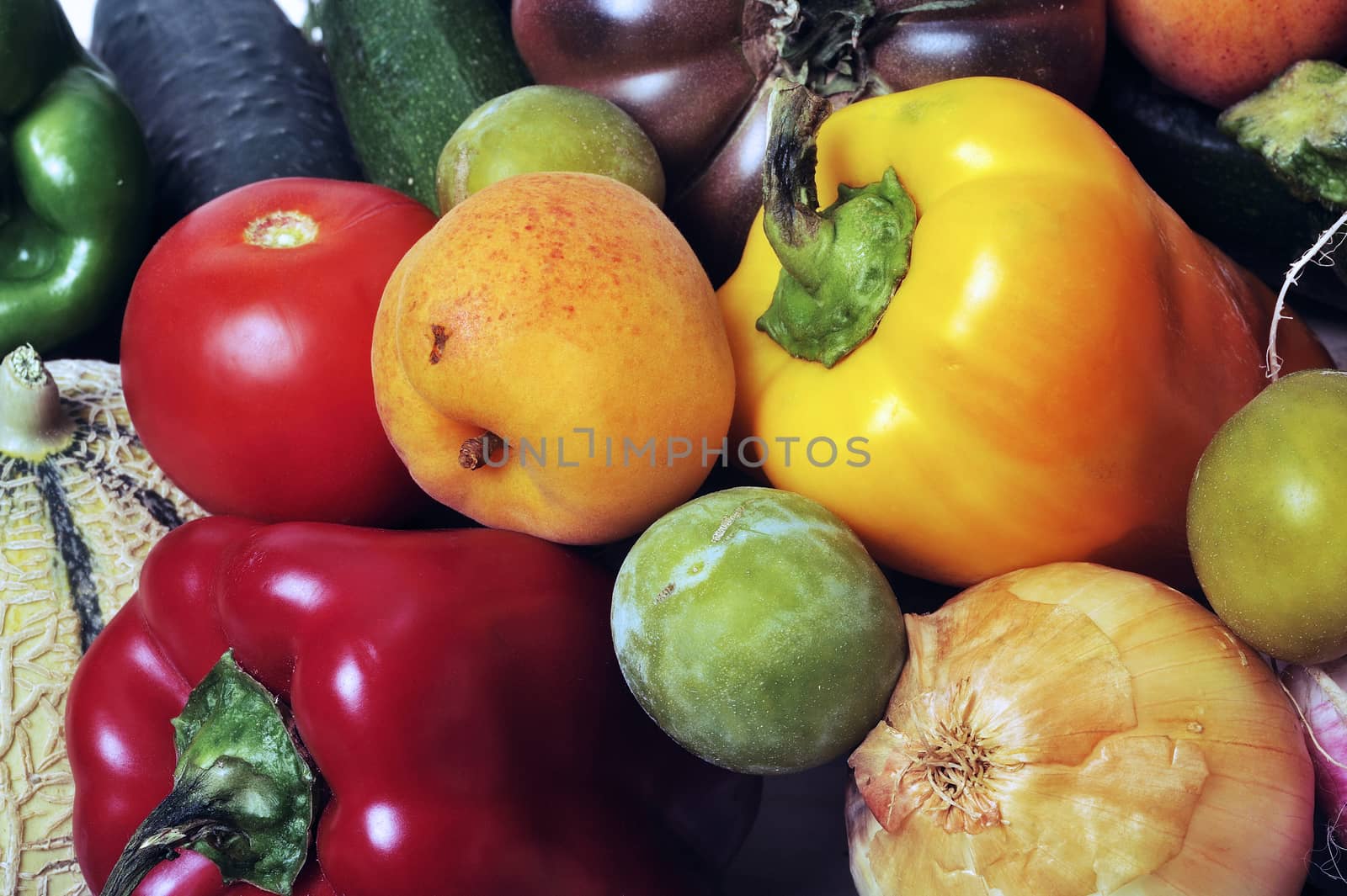 crates of fruit and vegetables on white background in studio. by gillespaire