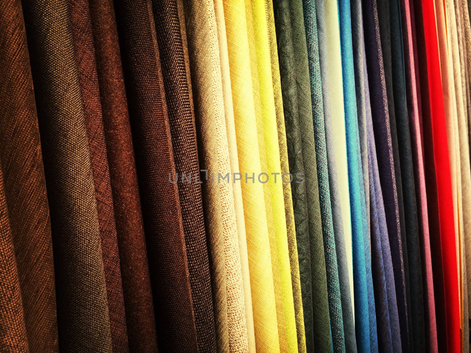 Colorful fabrics in a store by anikasalsera