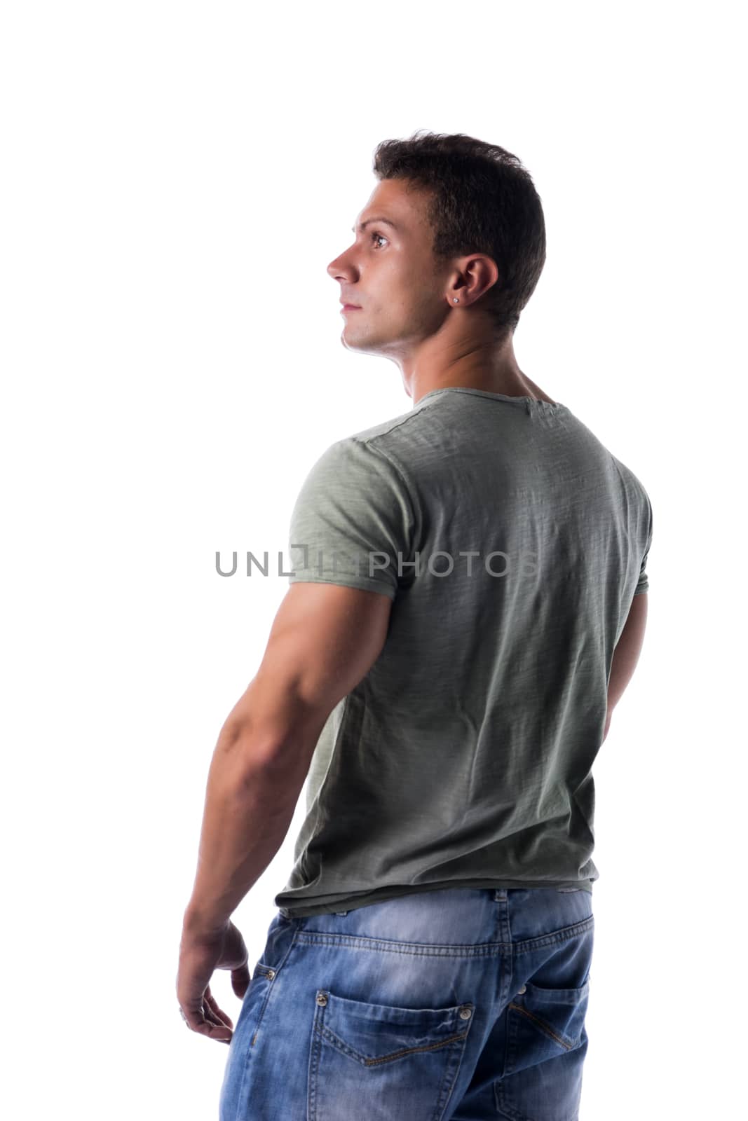 Handsome muscular fit young man isolated on white background looking to a side, back view