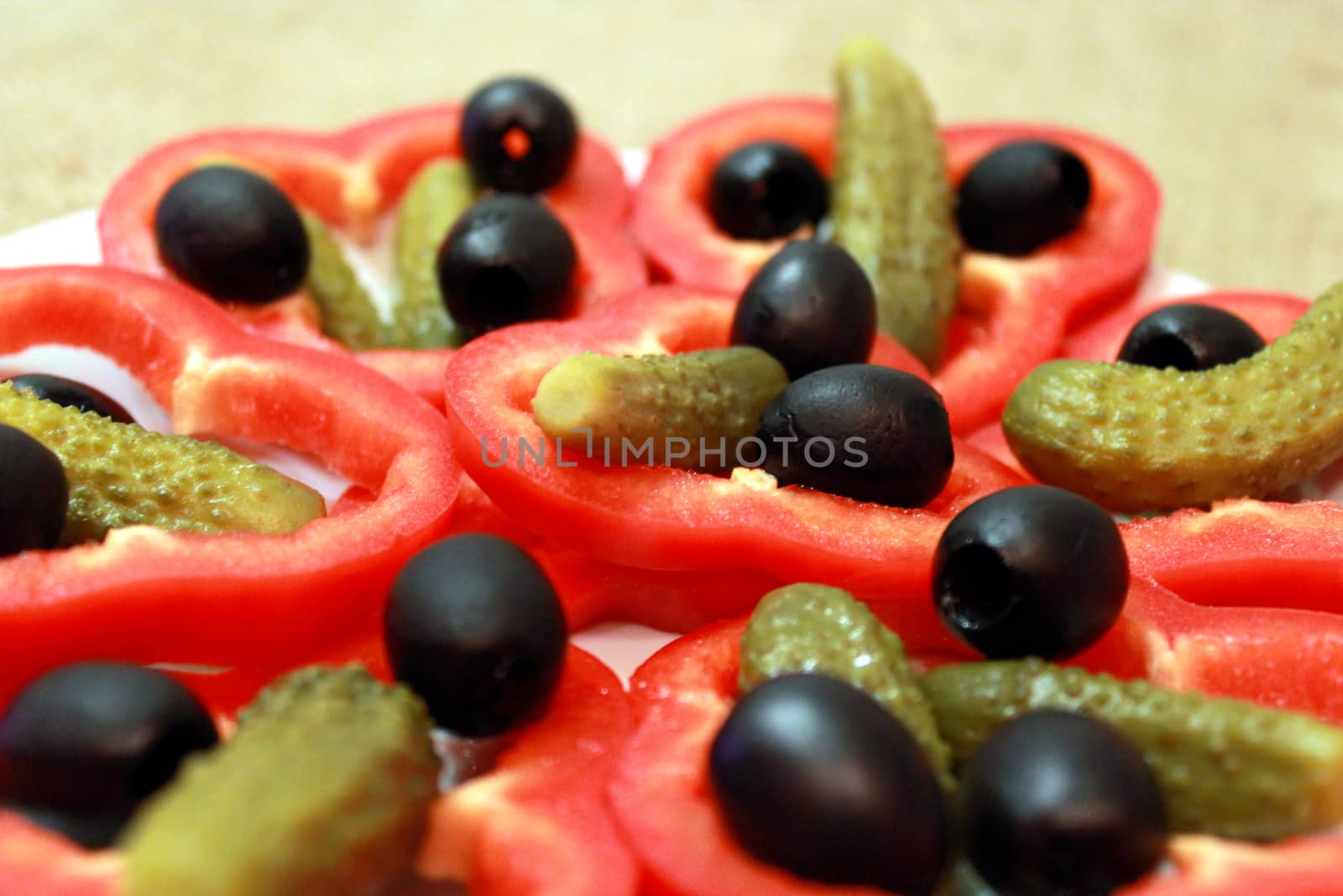 Black olives, marinaded cucumbers and paprika by alexmak