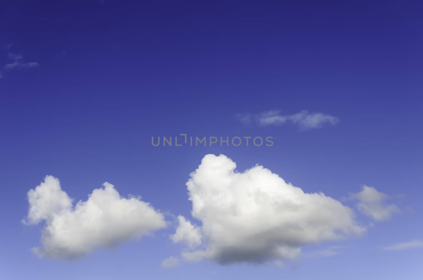 Fluffy cumulus clouds against blue sky