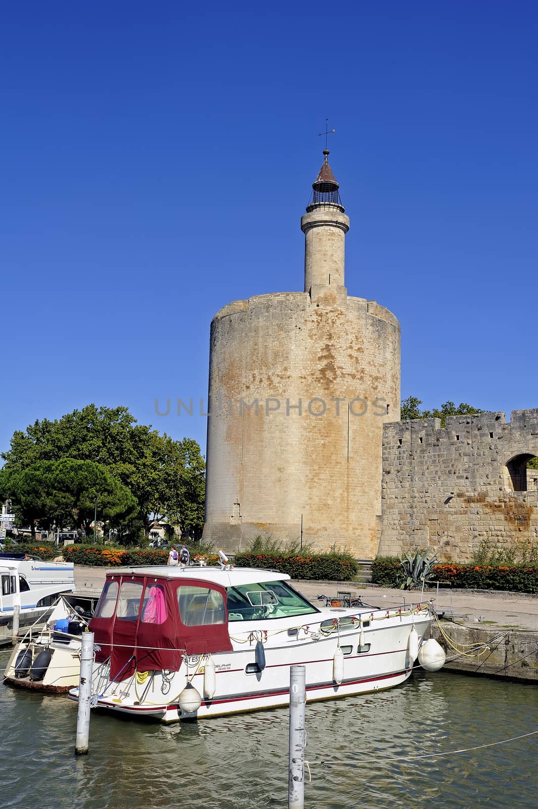 The marina of Aigues-Mortes in the background with the city walls.