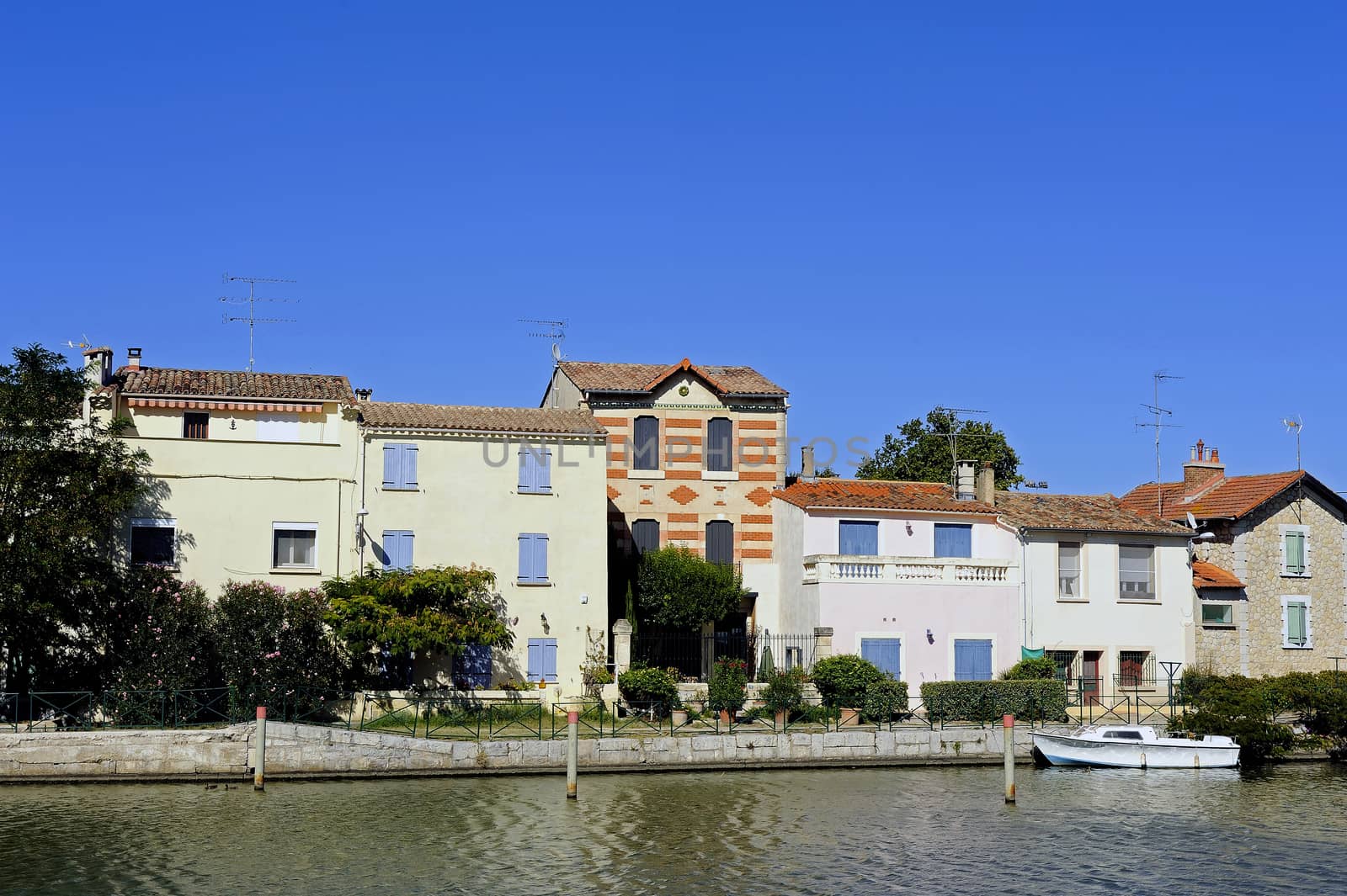 Houses on the canal in Aigues-Mortes in the heart of the Camargue in the south-east of France.