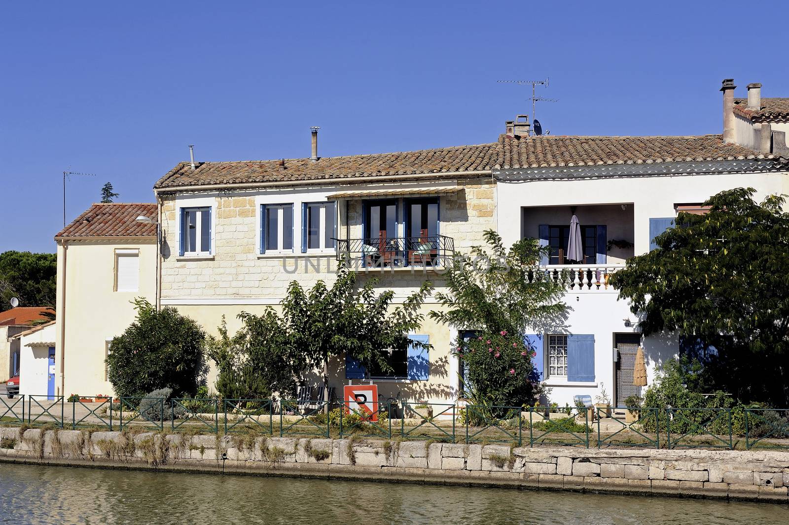 Houses on the canal in Aigues-Mortes in the heart of the Camargue in the south-east of France.