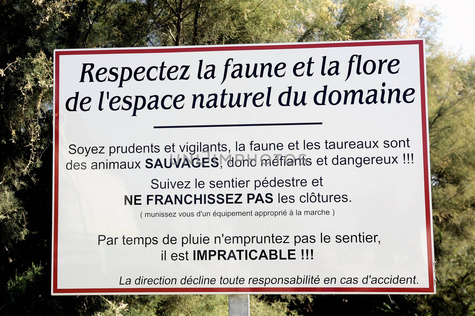 Warning for the respect for nature and its dangers before entering a trail of Camargue in the south-east of France.