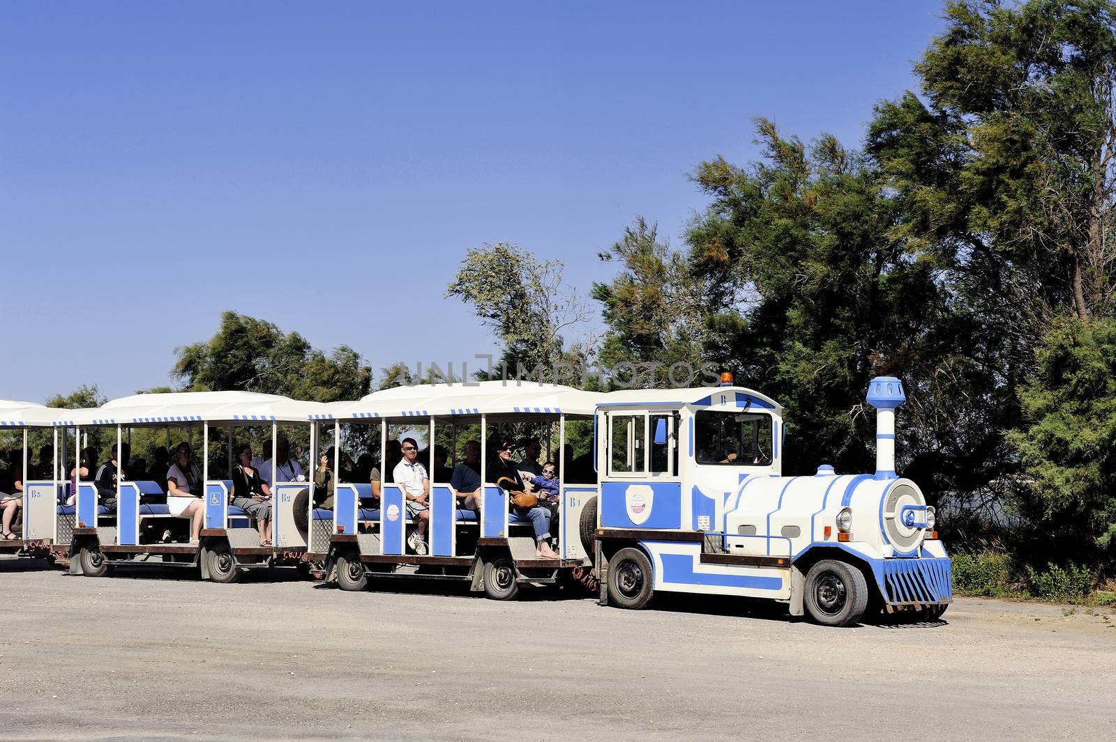 tourists in the tourist train to visit the salt business of Aigues-Mortes and to tour the mine salt site.