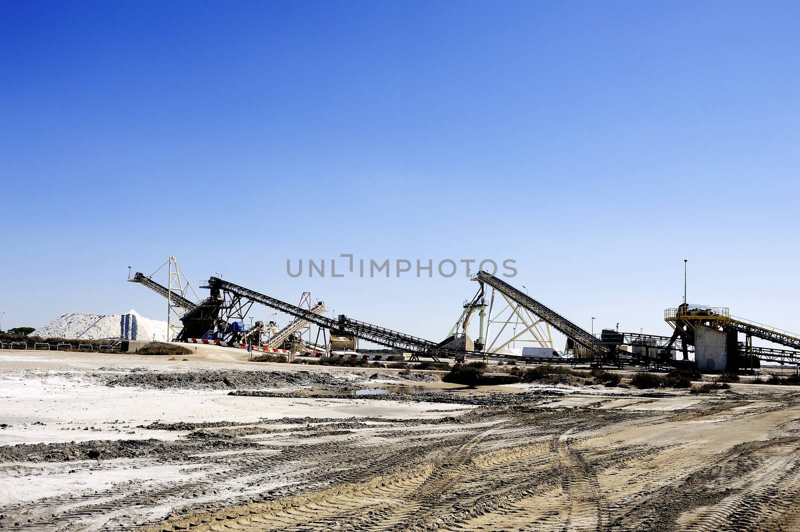 Site operating company saline Aigues-Mortes in the Camargue where stackers stack hills of sea salt.