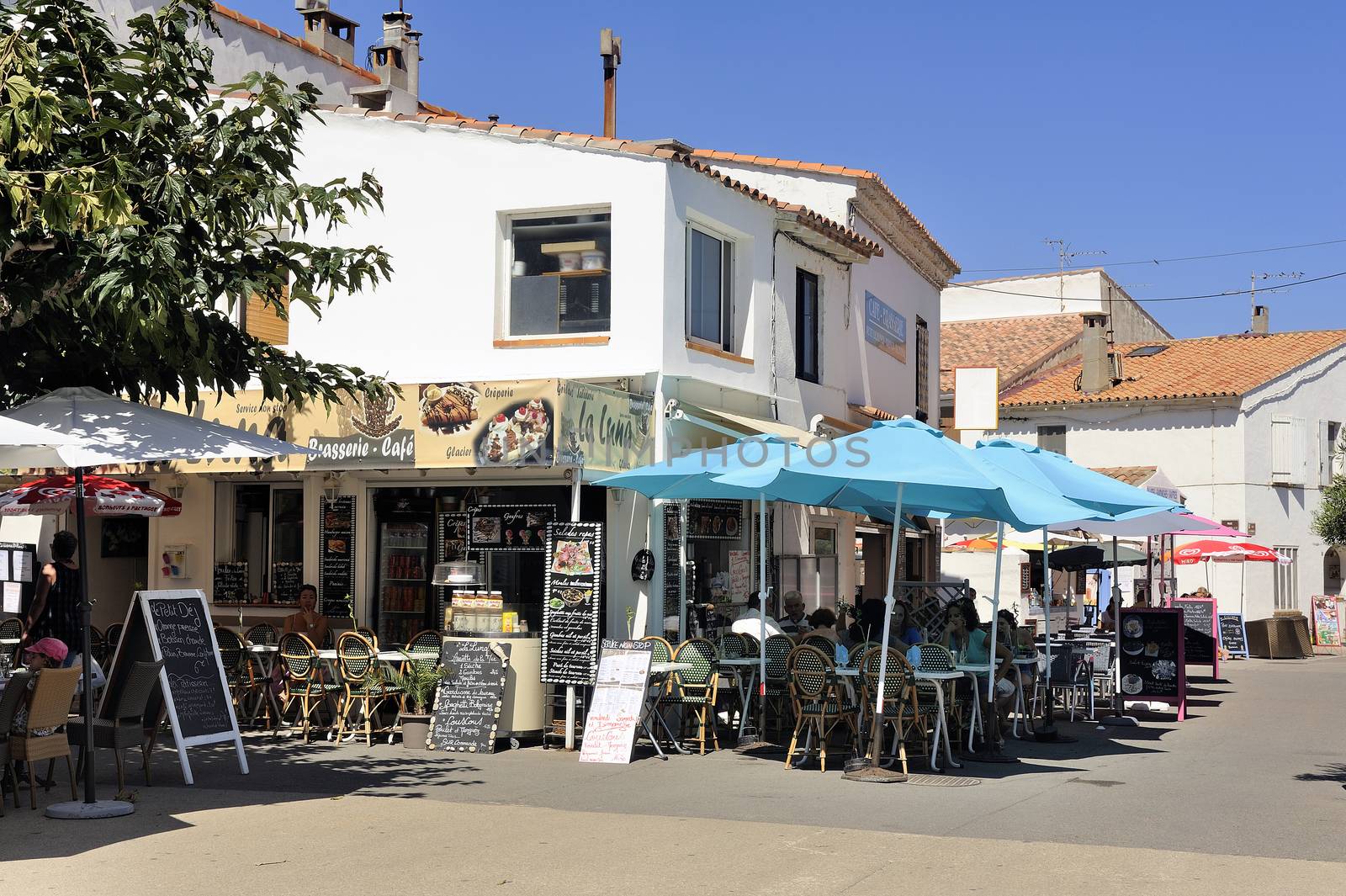 coffee shop in the city center of Saintes-Maries-de-la-Mer in the summer.