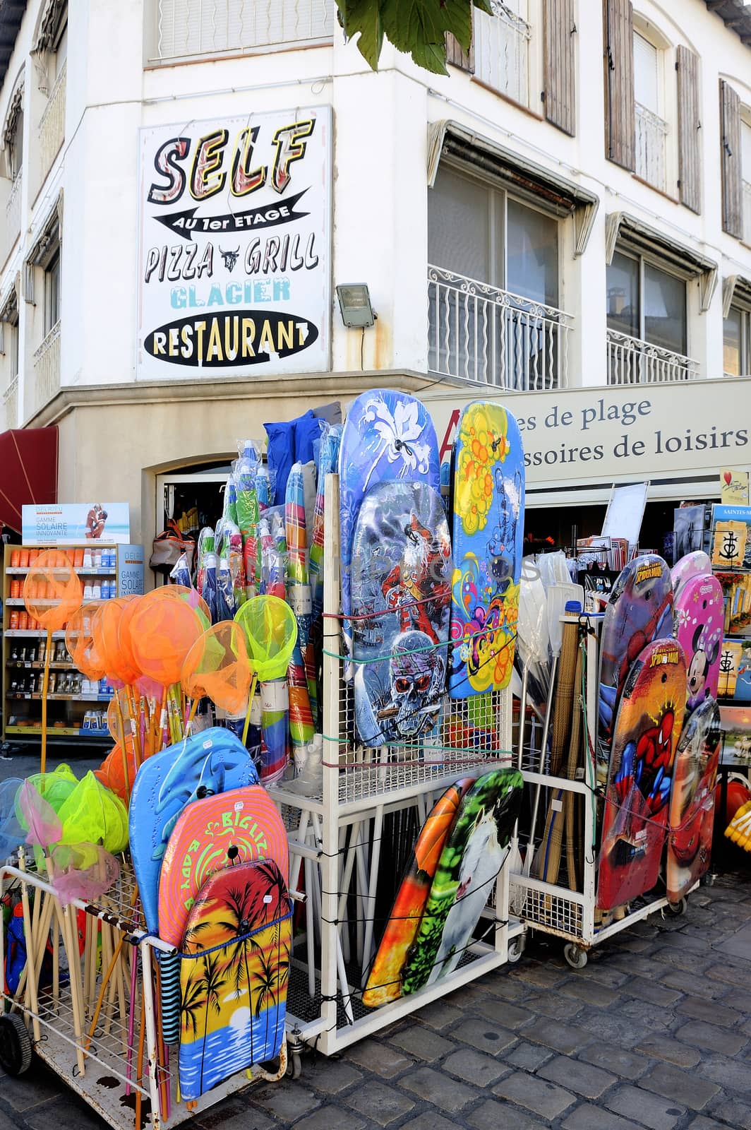 beachwear shop in the town of Saintes-Maries-de-la-Mer by gillespaire