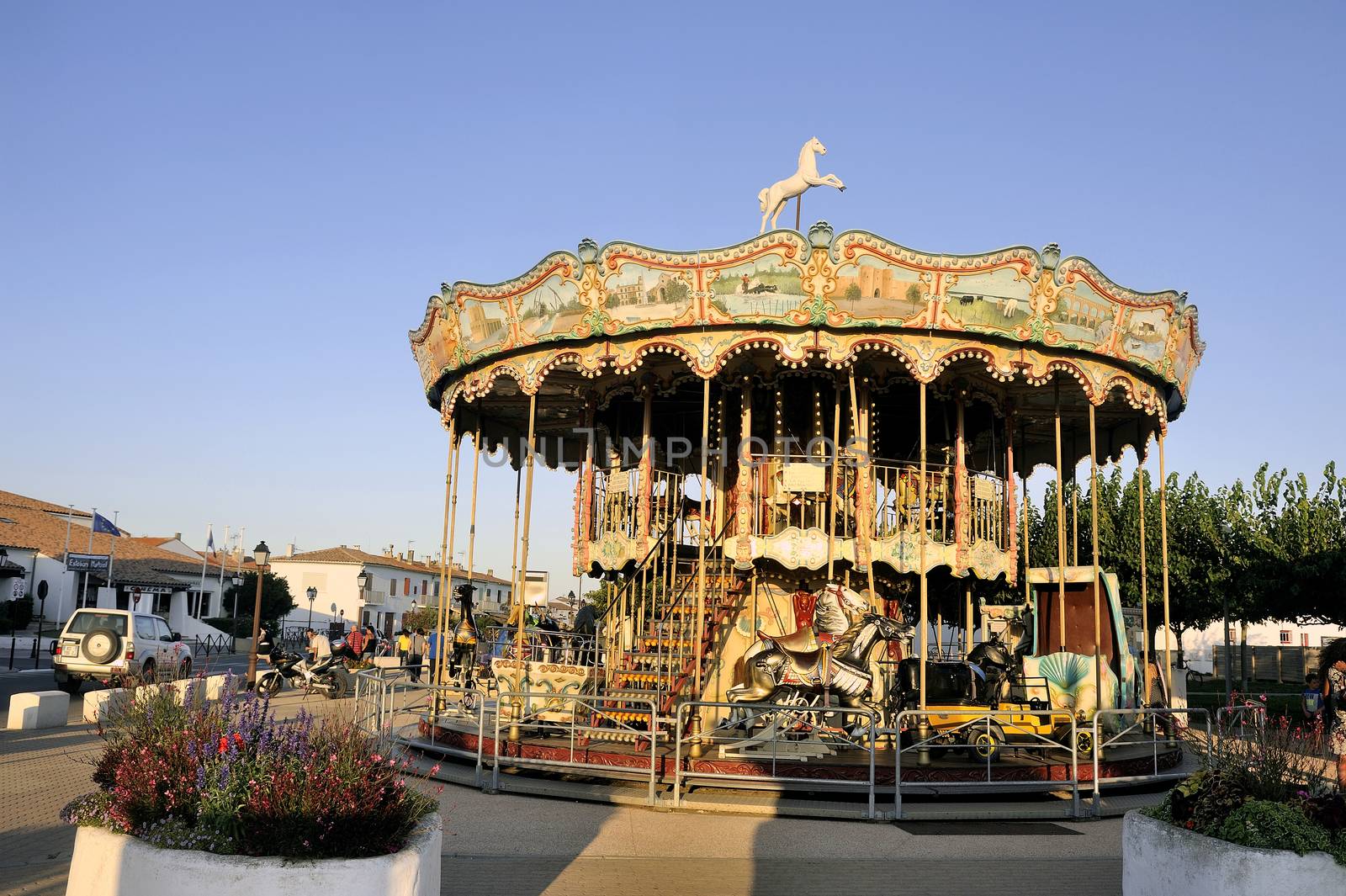 carousel with wooden horses decoration typical Camargue Saintes-Maries-de-la-Mer.