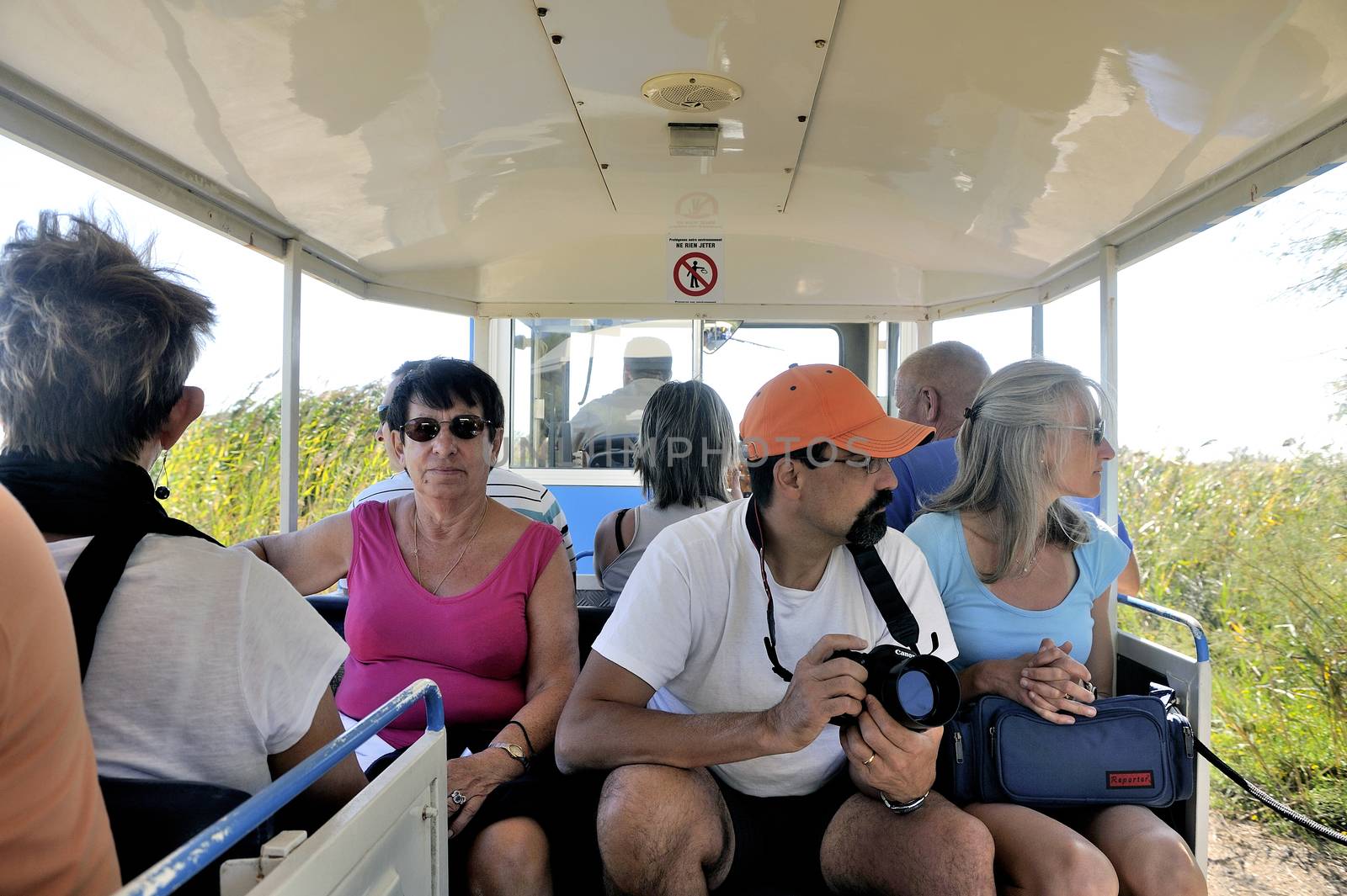 tourists in the tourist train to visit the salt business of Aigues-Mortes and to tour the mine salt site.