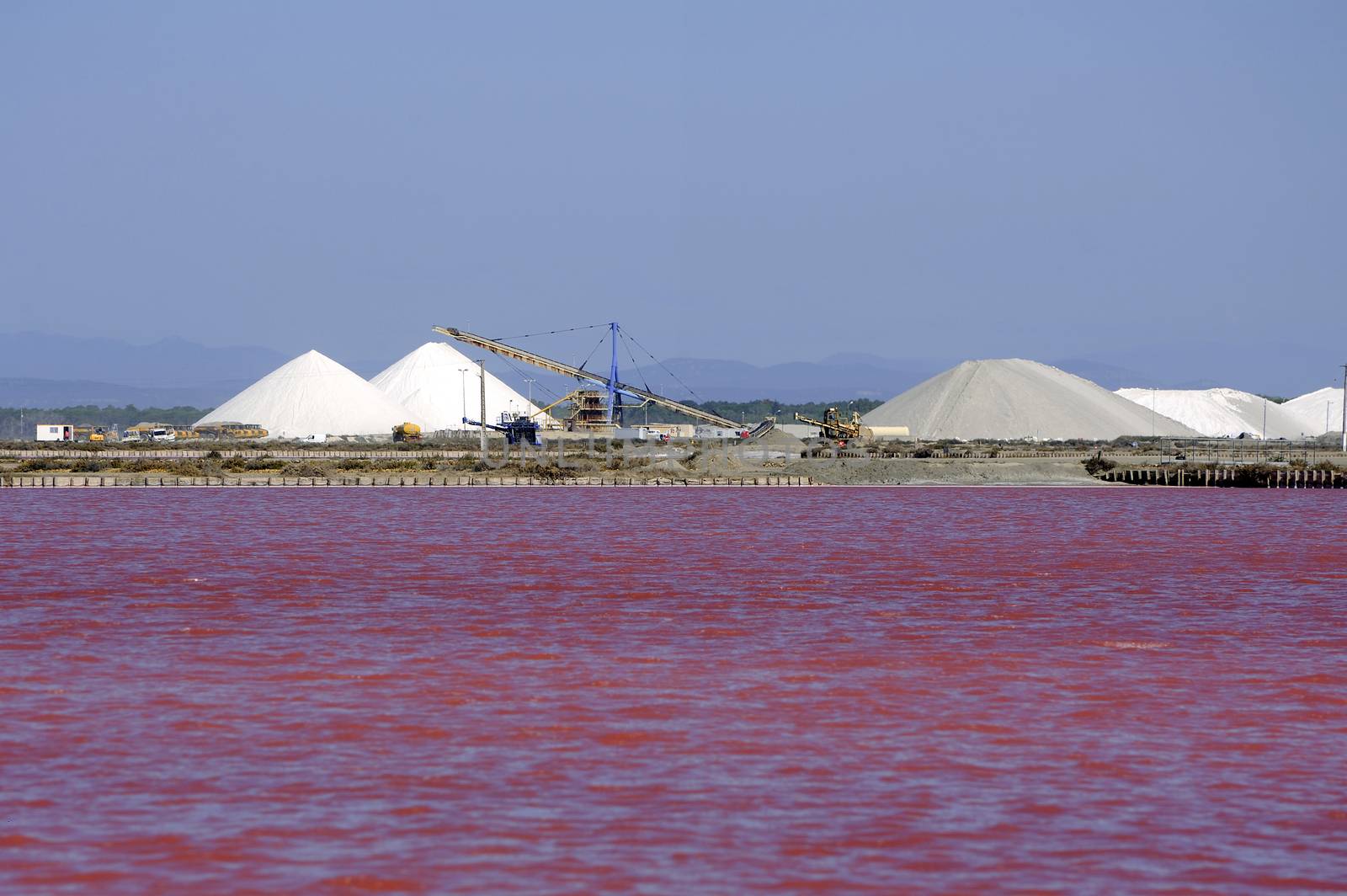 Site operating sea salt saline Aigues-Mortes in the season when a pink algae grow in the water, which gives this beautiful color.