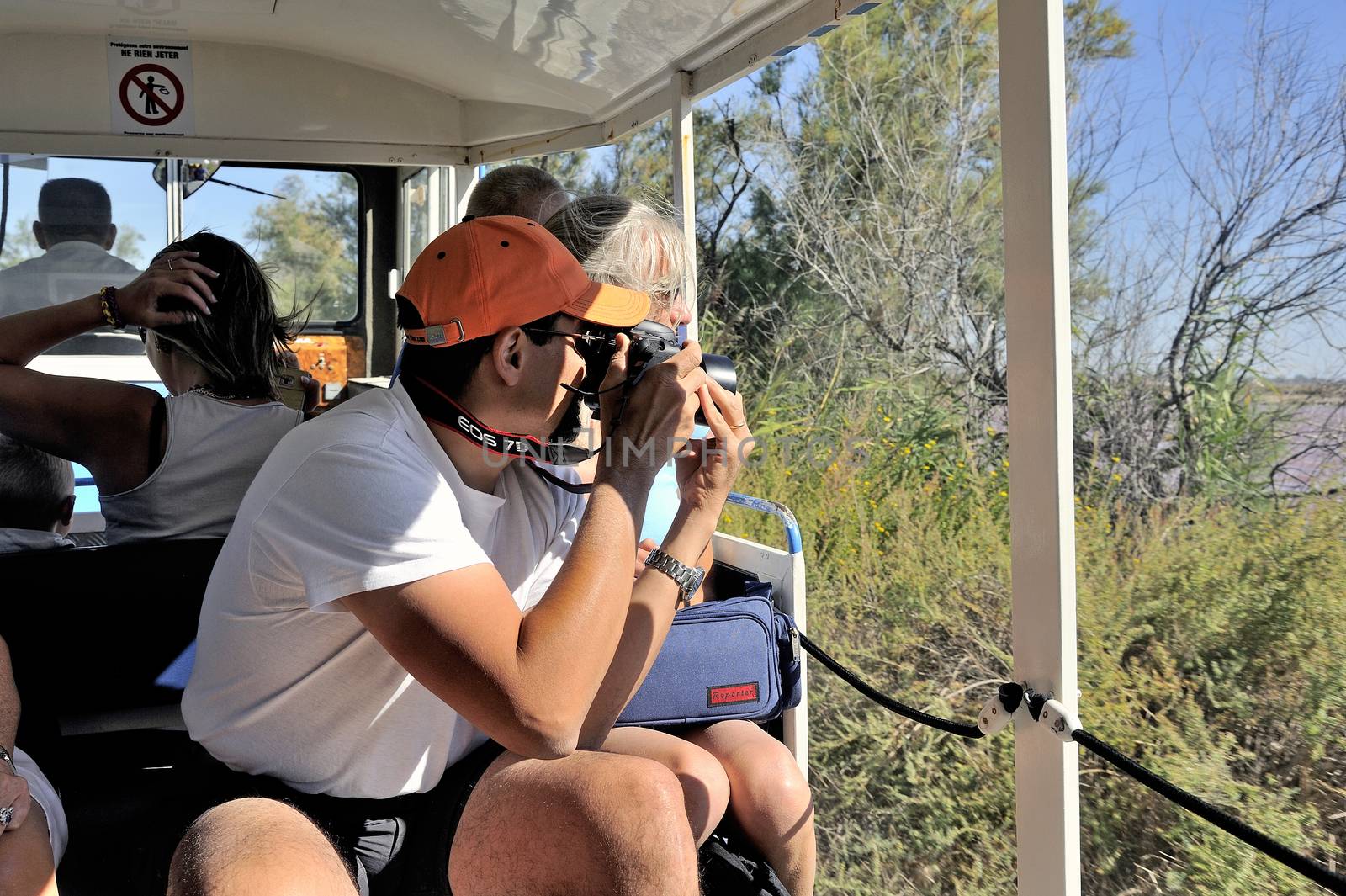 tourists in the tourist train to visit the salt business of Aigues-Mortes and to tour the mine salt site.