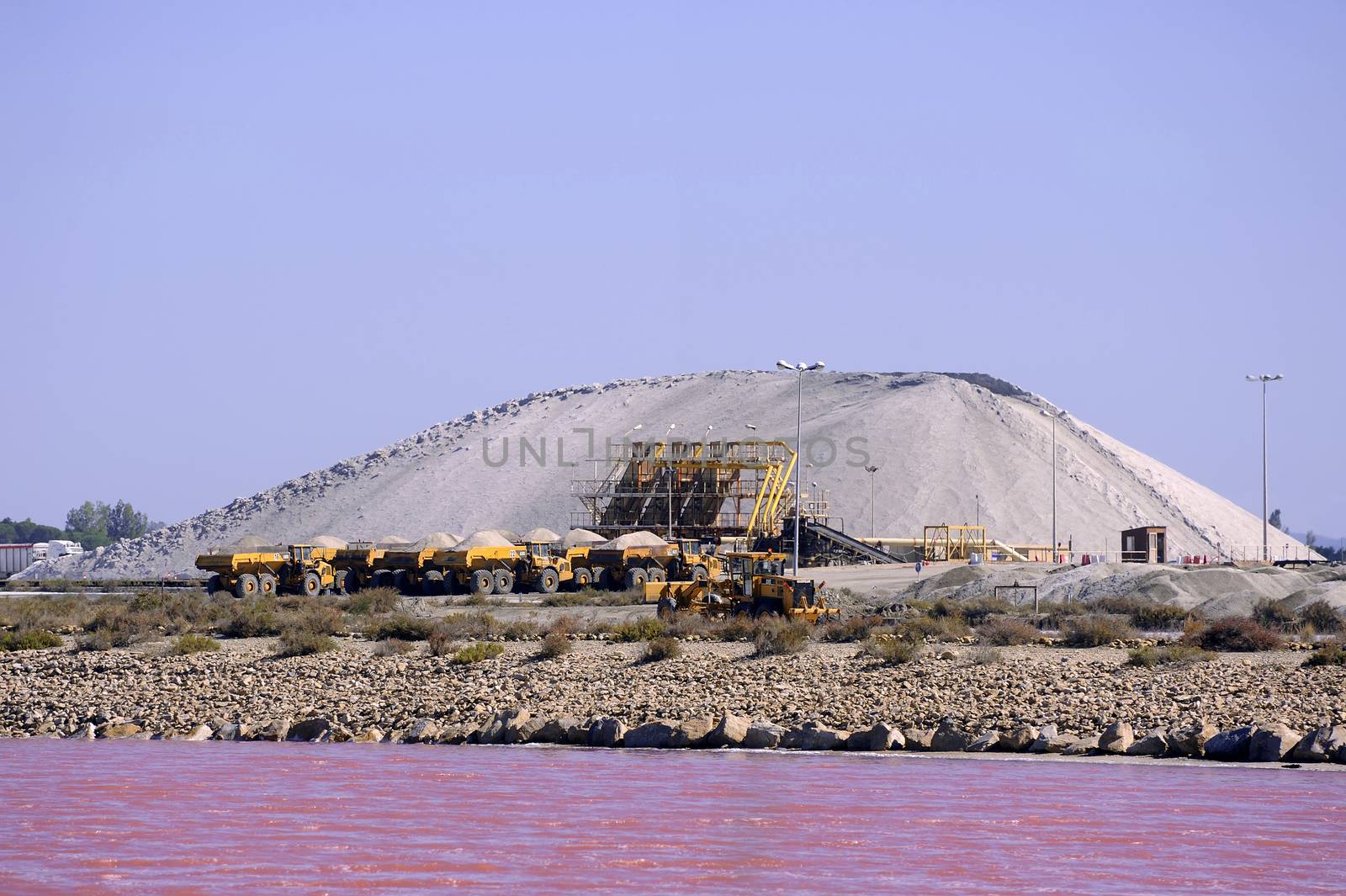 Site operating sea salt saline Aigues-Mortes in the season when a pink algae grow in the water, which gives this beautiful color.