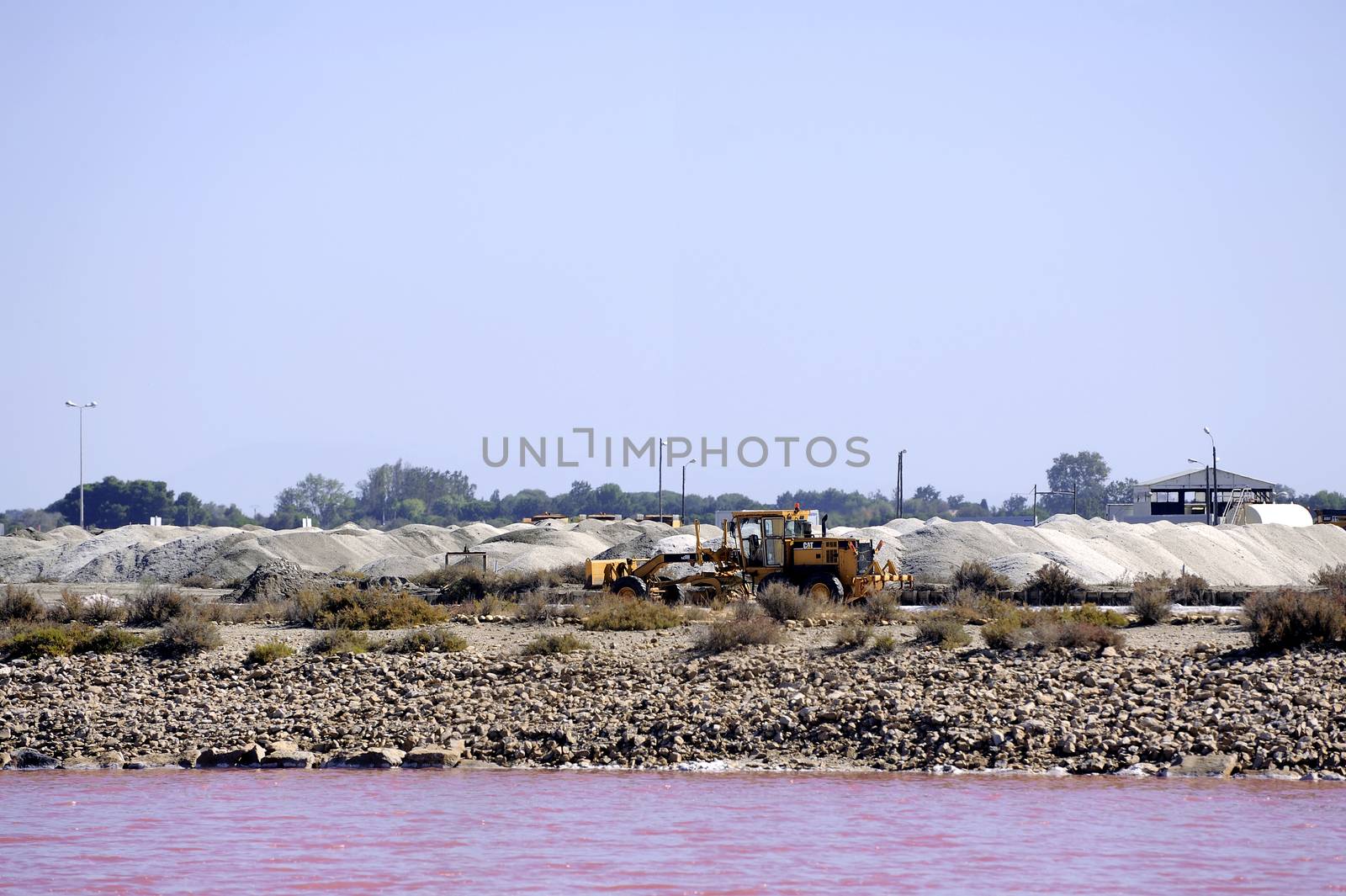 Site operating sea salt saline Aigues-Mortes in the season when a pink algae grow in the water, which gives this beautiful color.