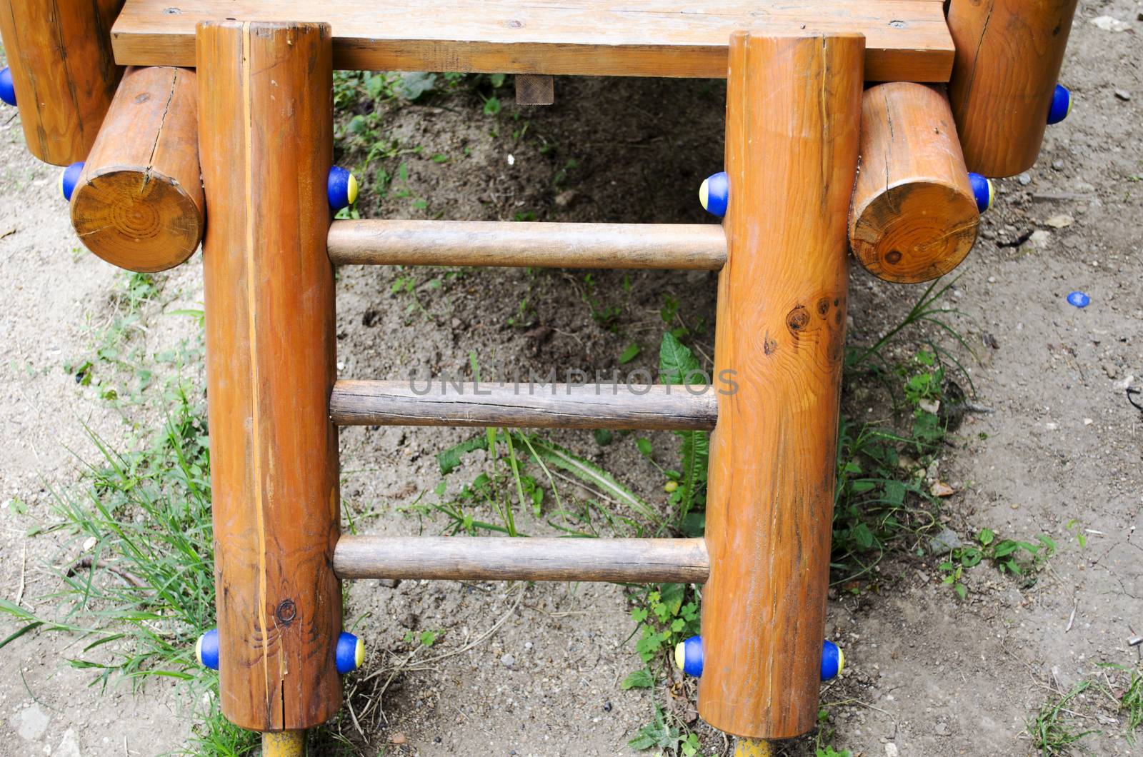 A set of stairs on a playscape at a playground.