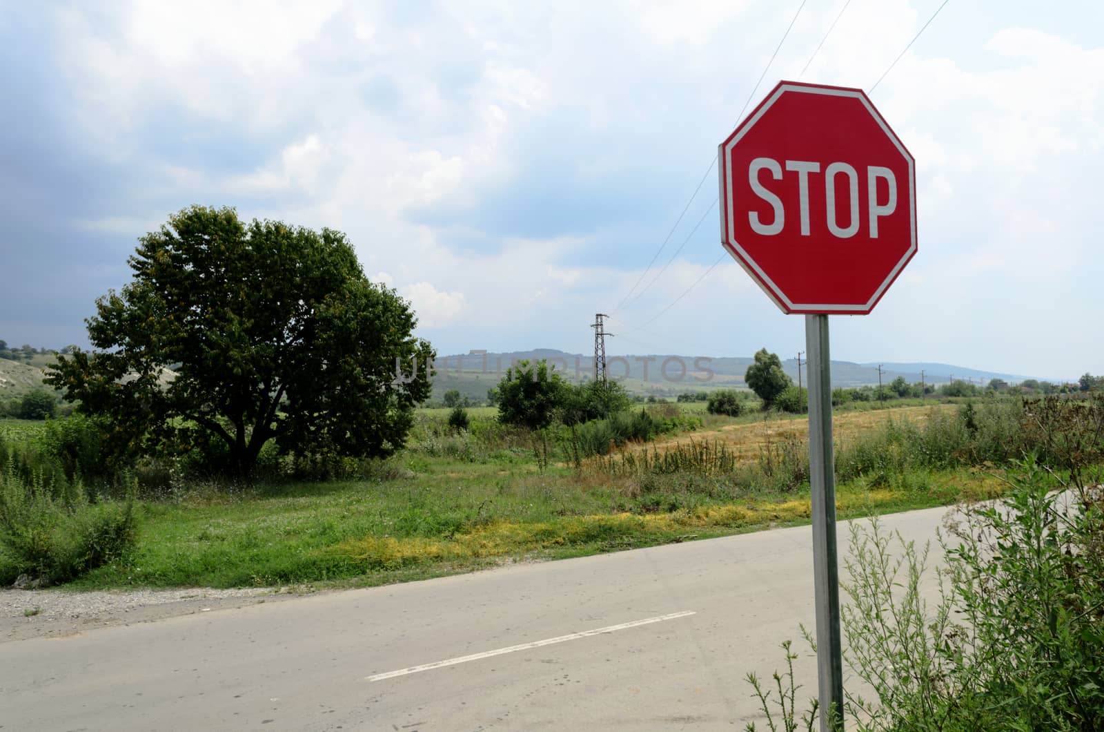 Stop sign in country road