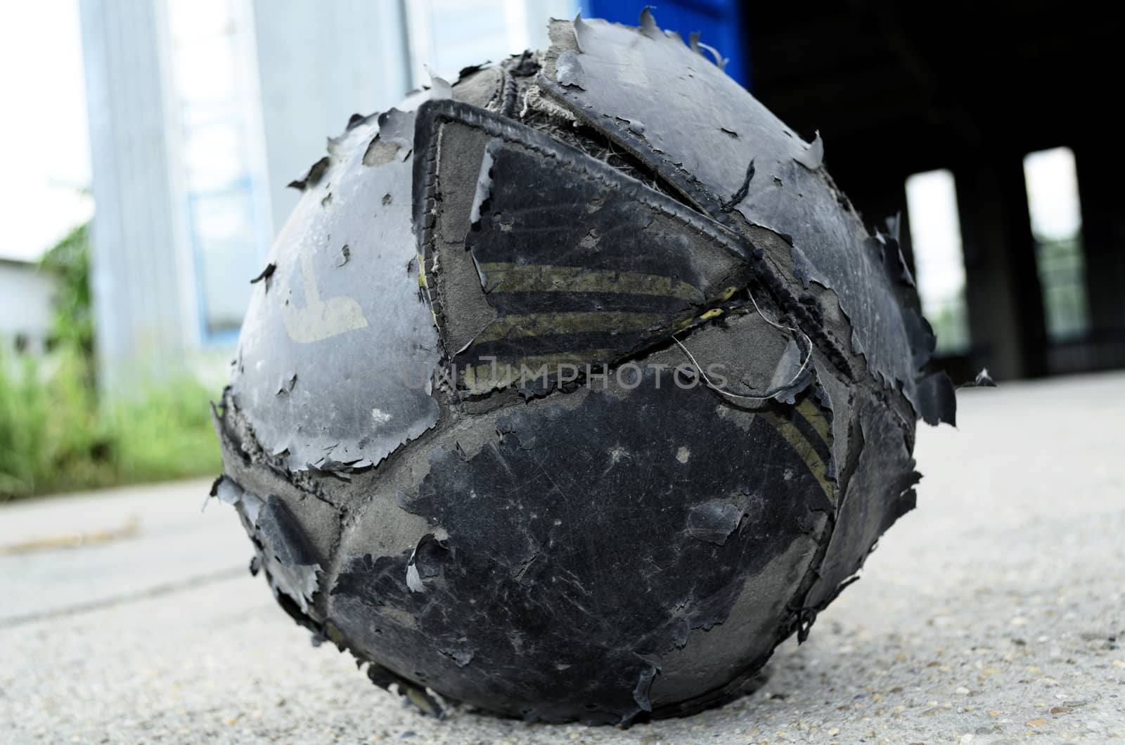 Old football ball badly ragged
