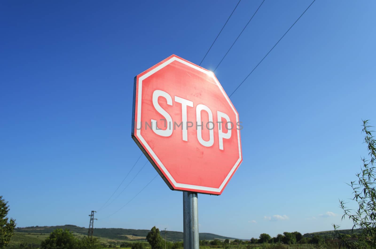 Stop sign in country road
