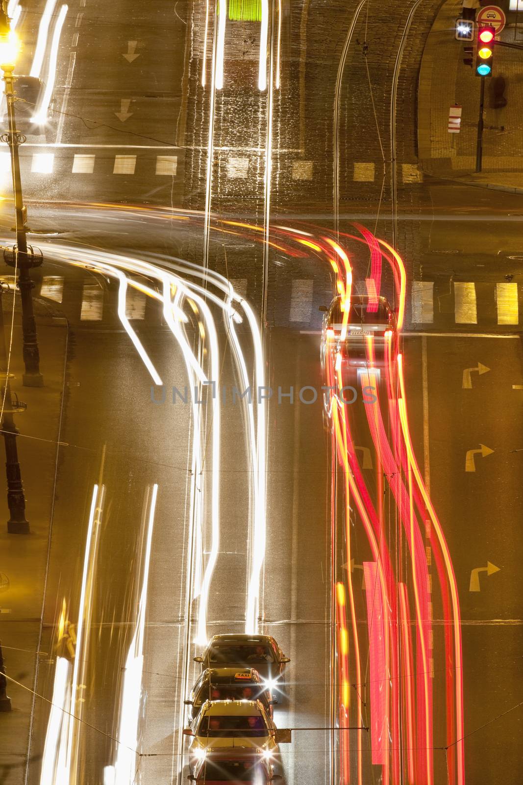 prague - high angle view of traffic on cechuv bridge at dusk