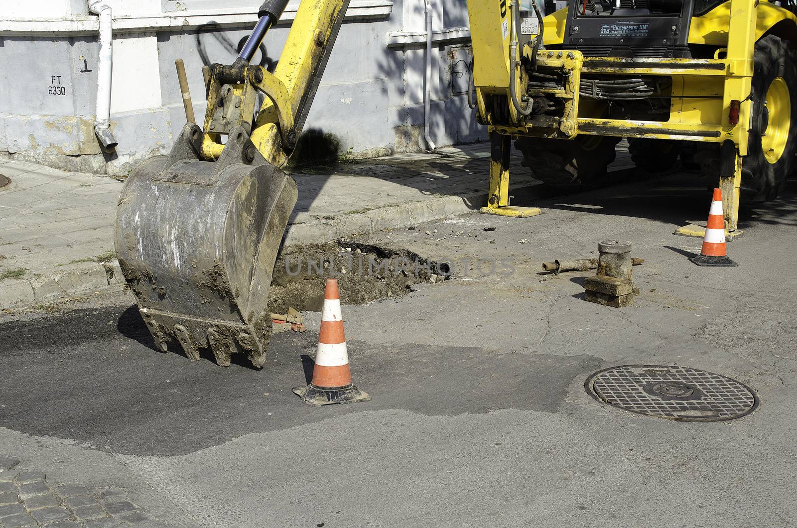 Public street maintenance works, excavator