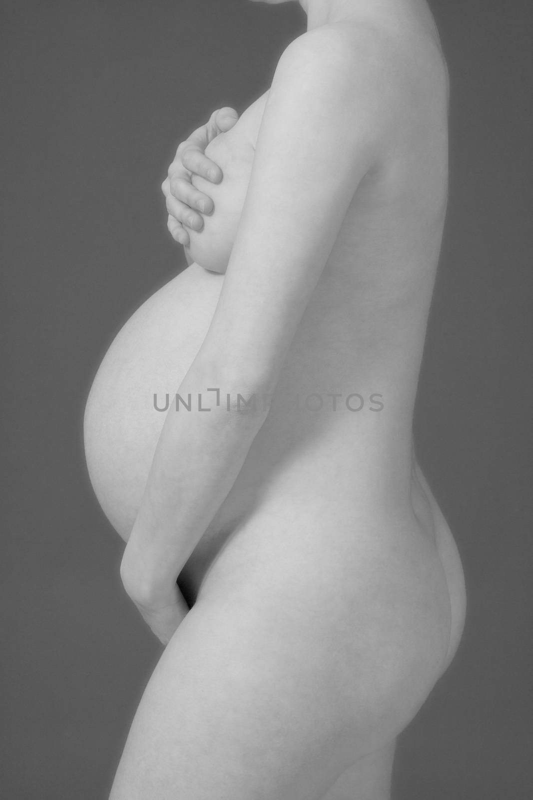 expecting woman - studio shot of a pregnant woman with cloth