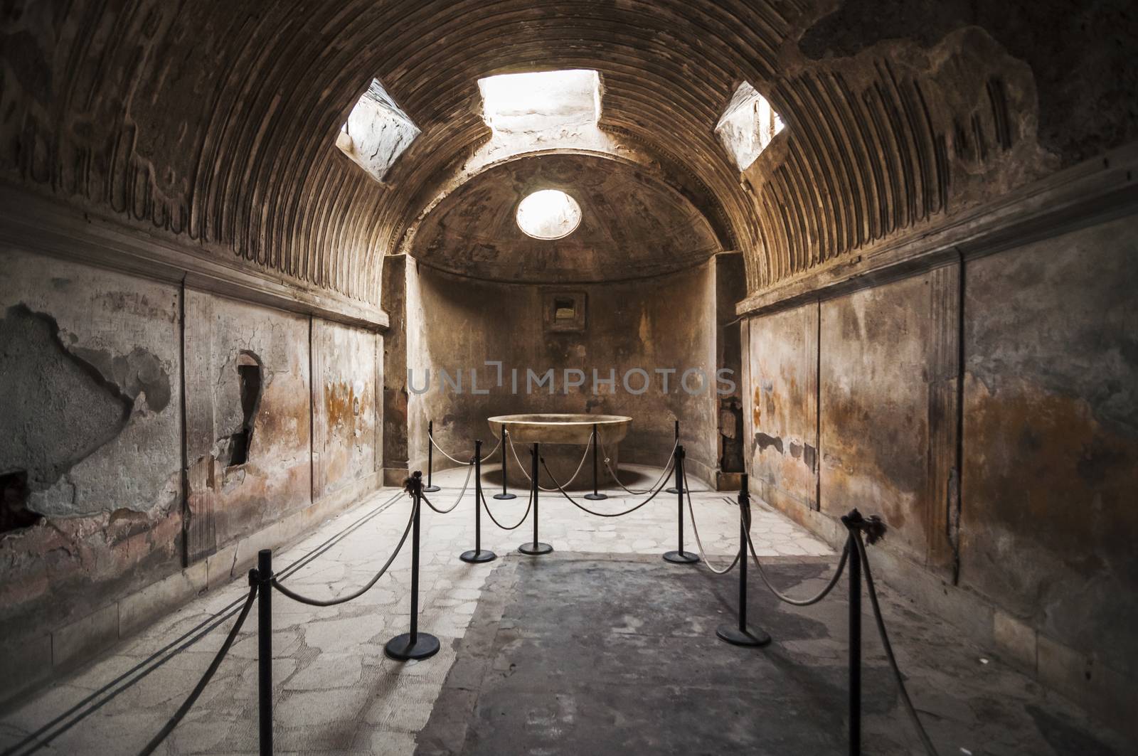 Roman Bath in the archeologic ruins of Pompeii in Italy