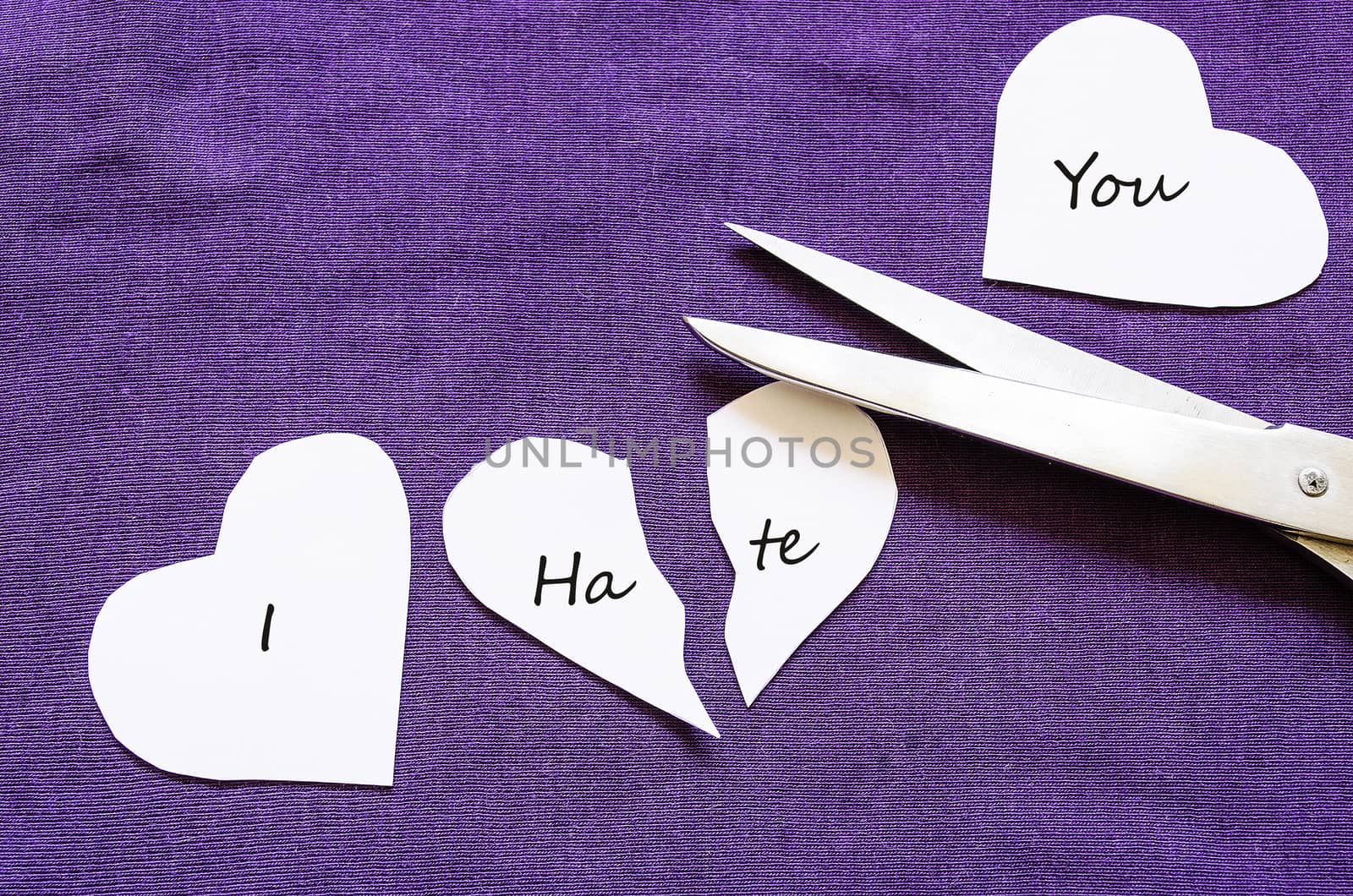 Scissors cutting paper with text I love you